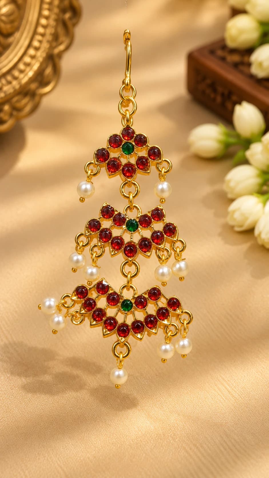 Elegant 3 Step Chutty imitation jewellery with gold tone, red & green stones, and dangling pearls.
