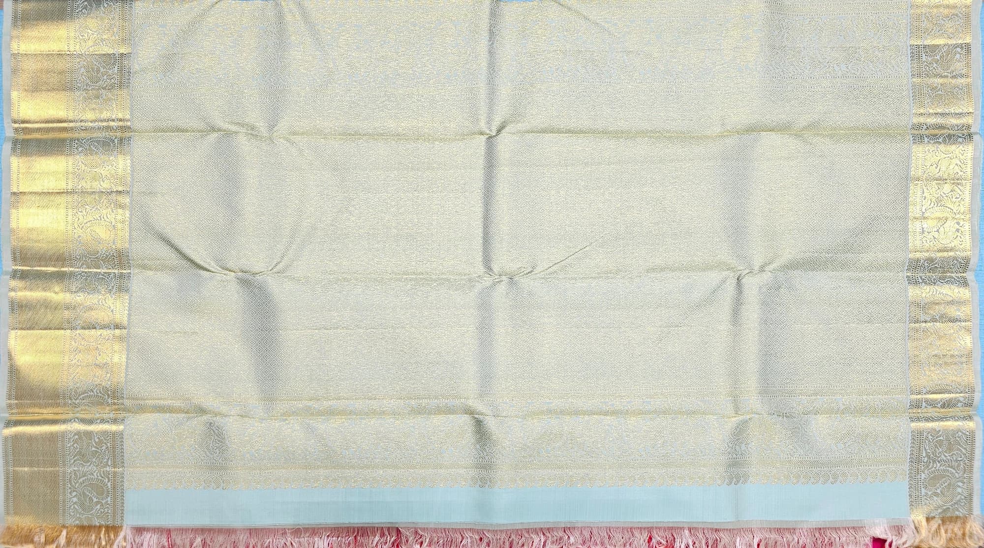 Kanchipuram Silk Saree with Cream body, Pista Green border, Pink fringes, & Gold Zari. Arangetram.