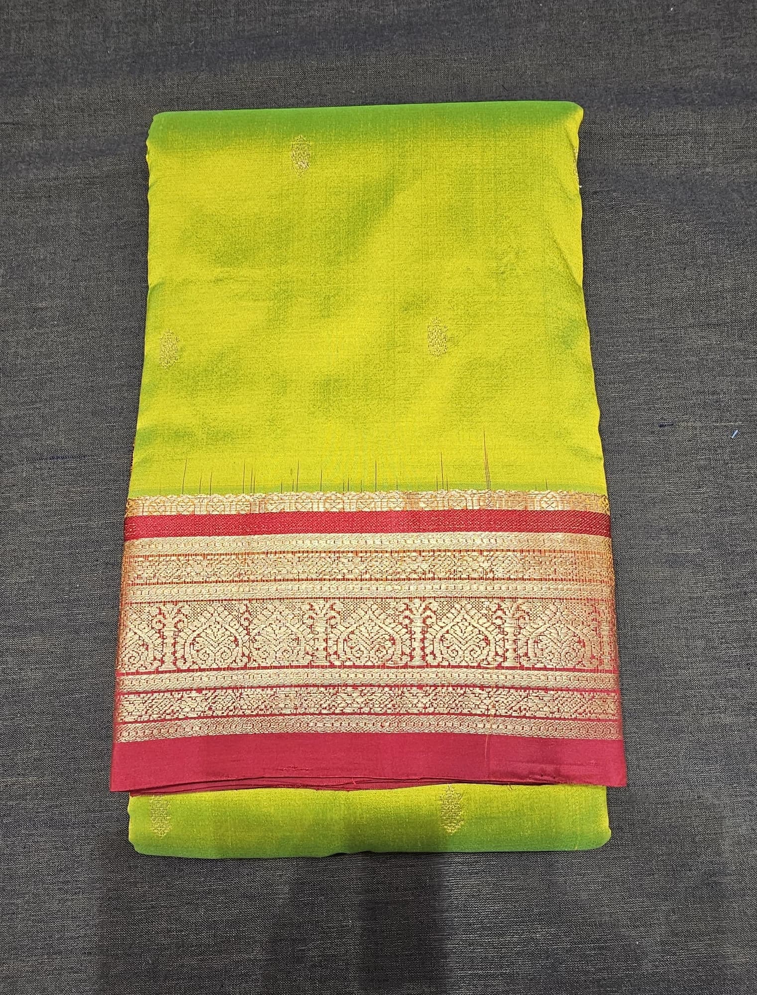 Sneha Green w Maroon Dharmavaram Silk Saree: vibrant green with subtle motifs & intricate gold woven maroon border.