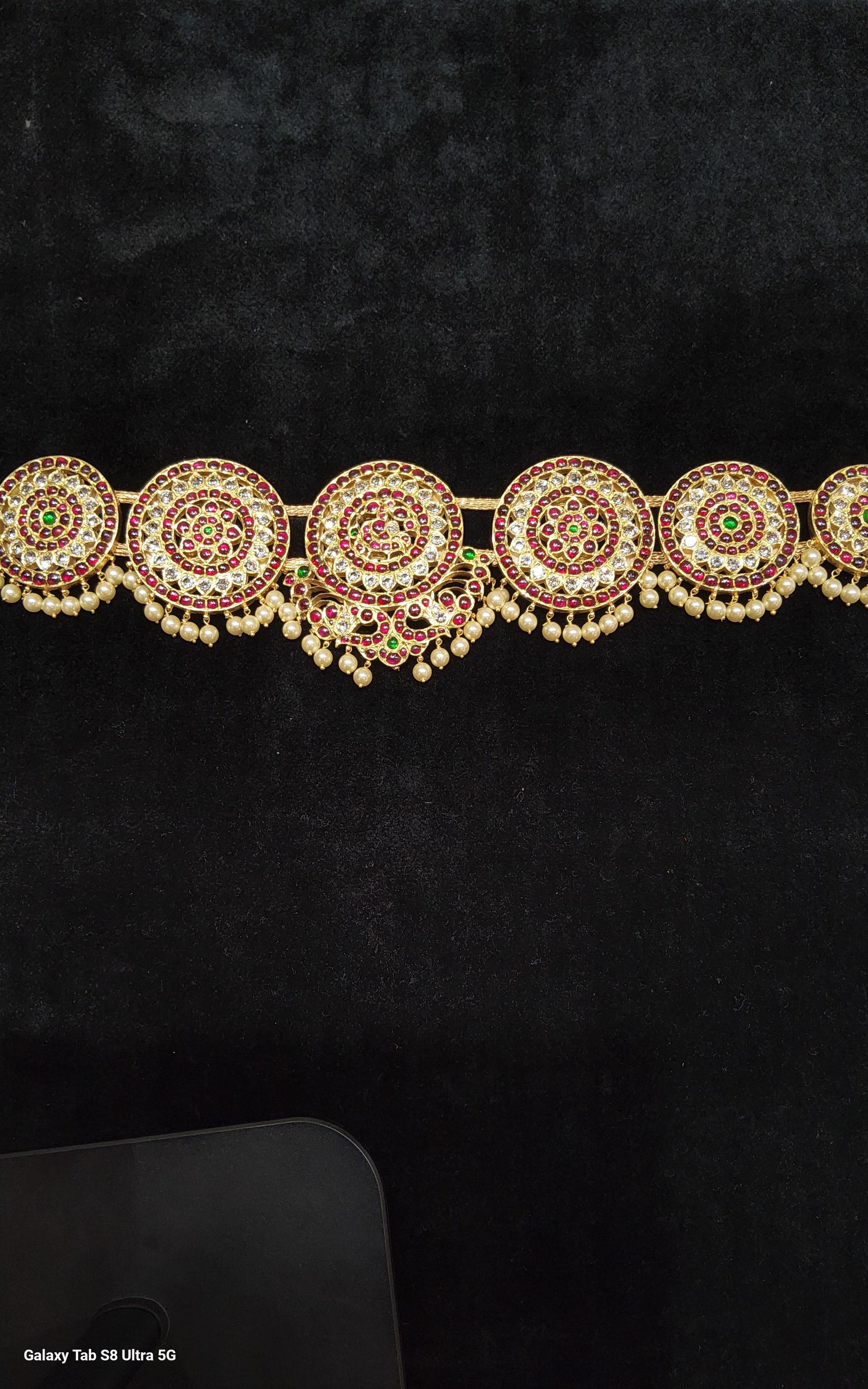 Close up: Peacock Belt, handcrafted temple jewellery detail, silver gold leaf