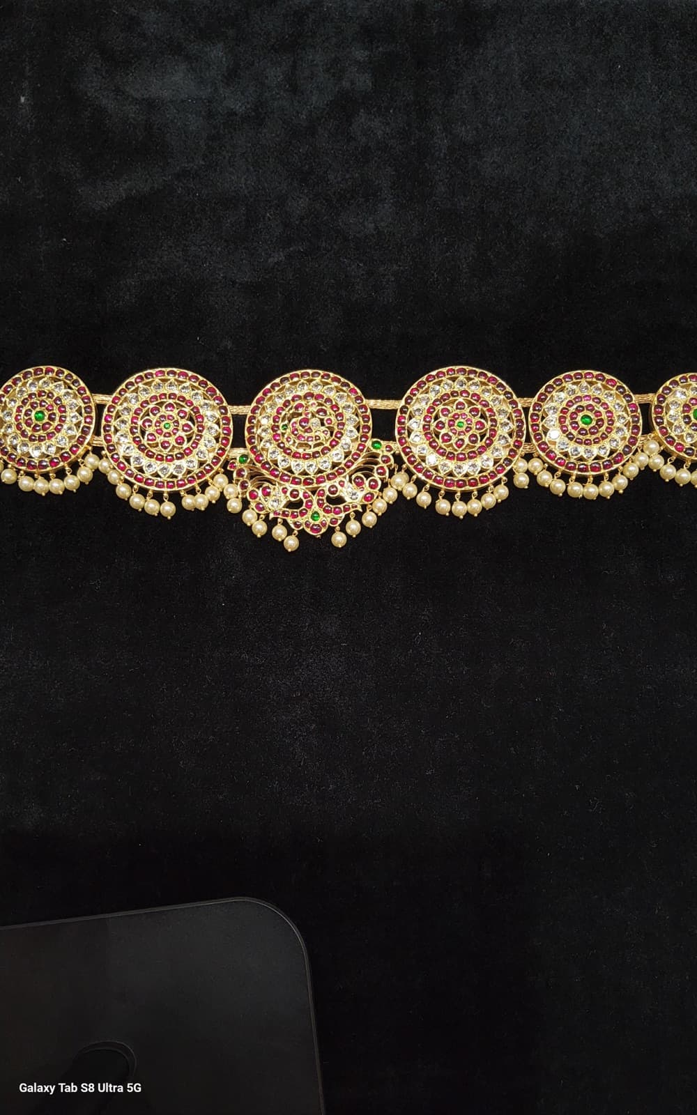 Close up: Peacock Belt, handcrafted temple jewellery detail, silver gold leaf