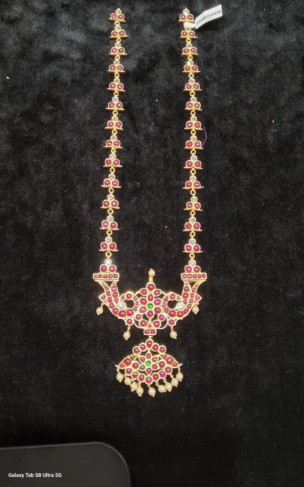 Long Malai Original Temple Jewellery. Handmade silver gold necklace close-up.