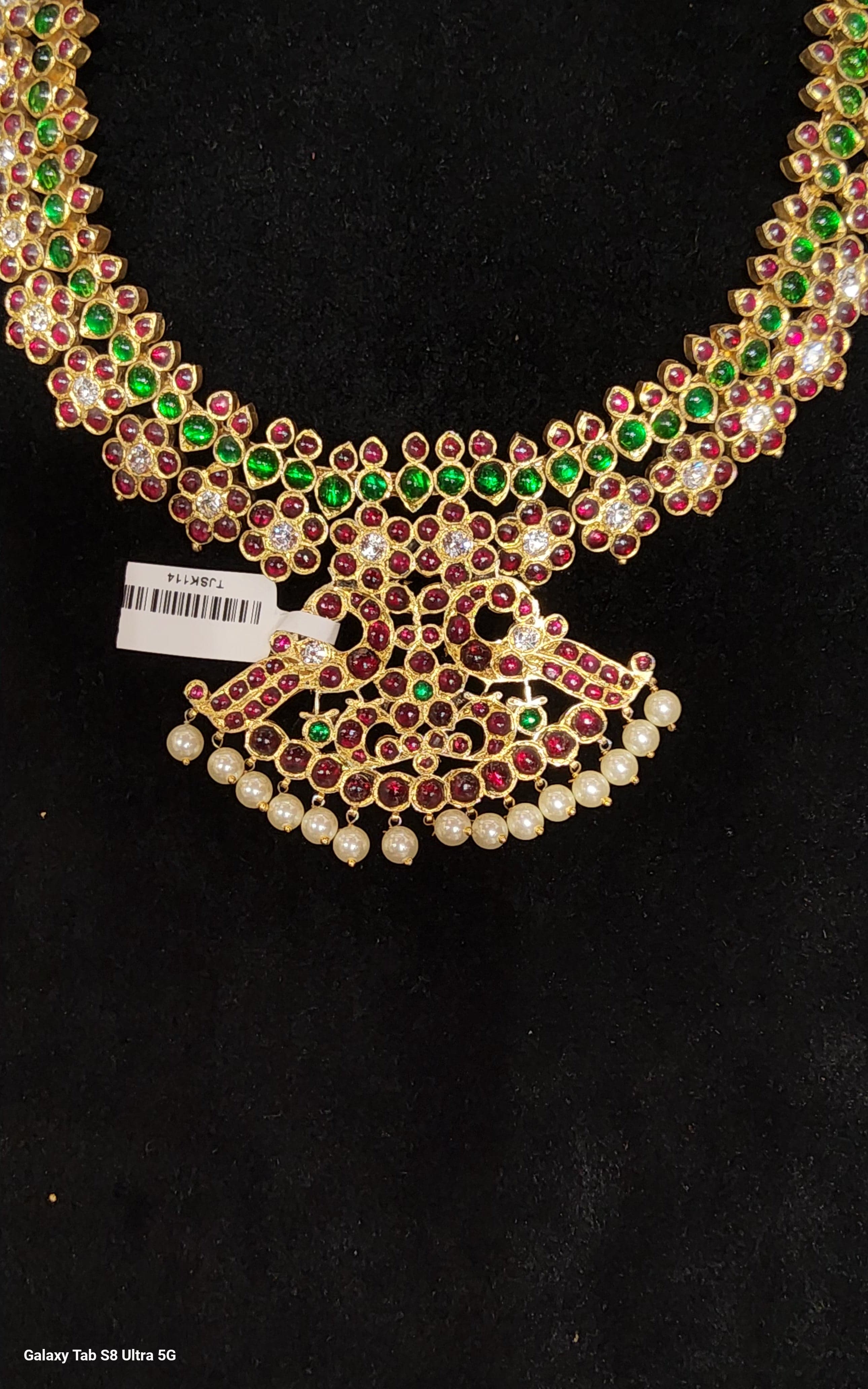 Flowers Necklace: Close up of handmade temple jewellery, pure silver with gold leafing