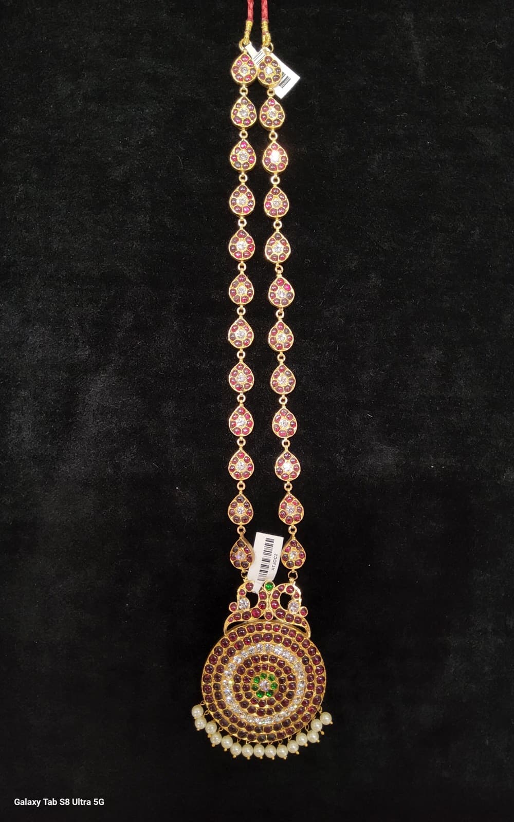 Big Dollar Original Temple Jewellery pendant, intricate gold design on a dark background. Traditional Indian jewelry.