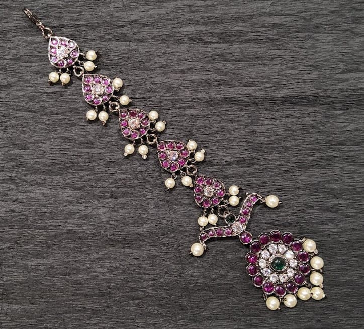 Single Chutty Black Series: Close-up of black copper and glass stone embellishments. Bharatanatyam.