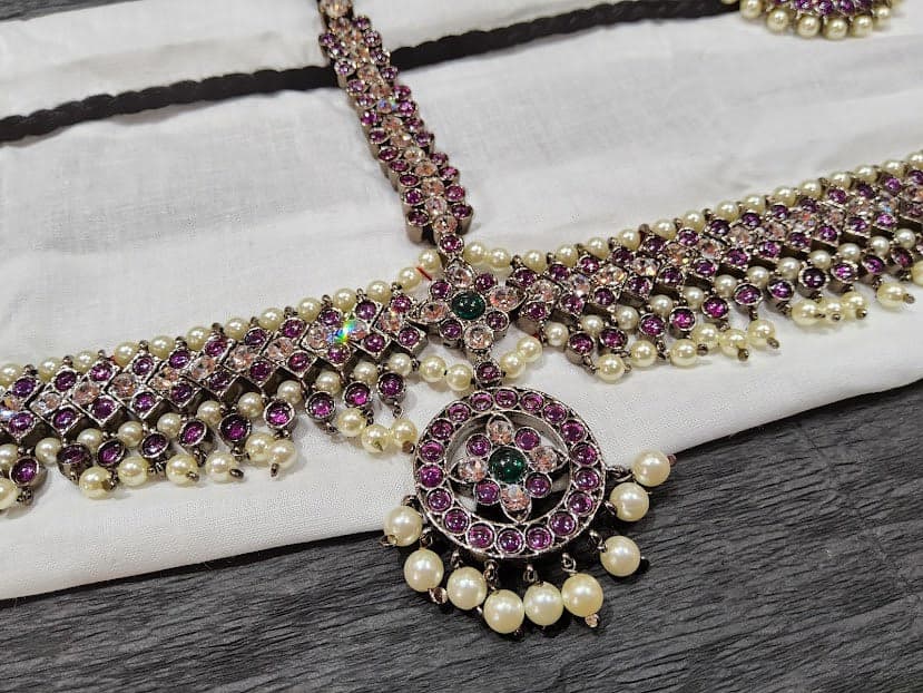 Black Series Headset: Copper temple jewellery. Black finish, pink & green stones. Arangetram jewellery.