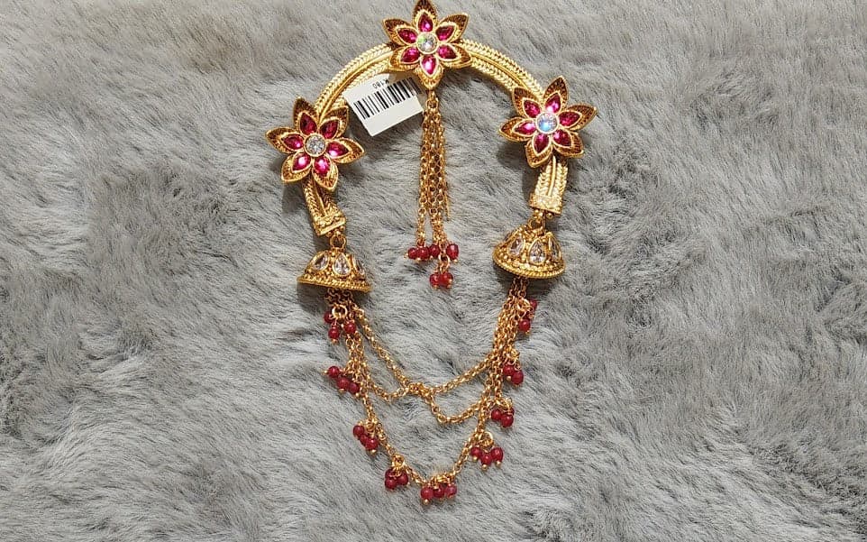 Antique Floral Arch Jada Billai: Side view showcasing layered decorative chains.