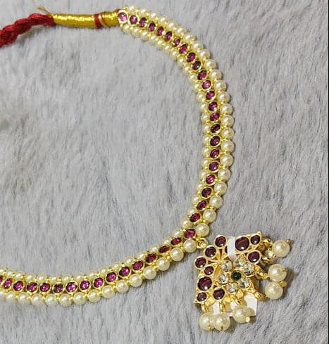 Margam Copper Necklace close-up: Traditional Indian jewelry, copper necklace with stone detail