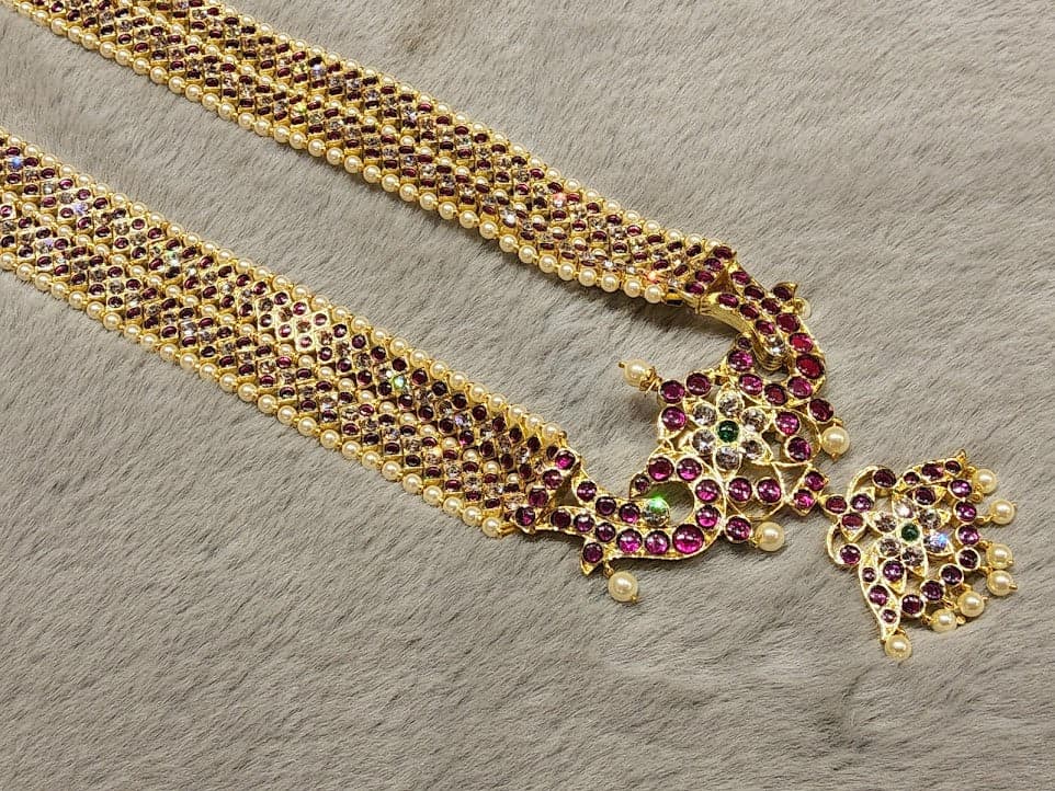 Close-up: DOUBLE V HARAM Copper Margam NJ011. Detailed copper & stone setting, V-shaped pattern for dance performances.