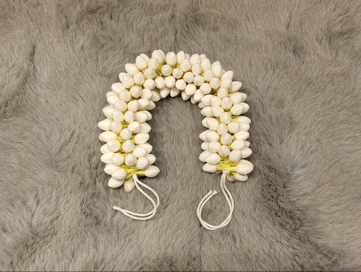 Artificial jasmine flower buds for dance hair. Foam-based, lightweight, and reusable.