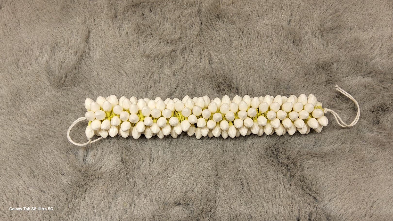 Close-up of small artificial jasmine flowers. Ideal for Bharatanatyam and Kuchipudi hairstyles.