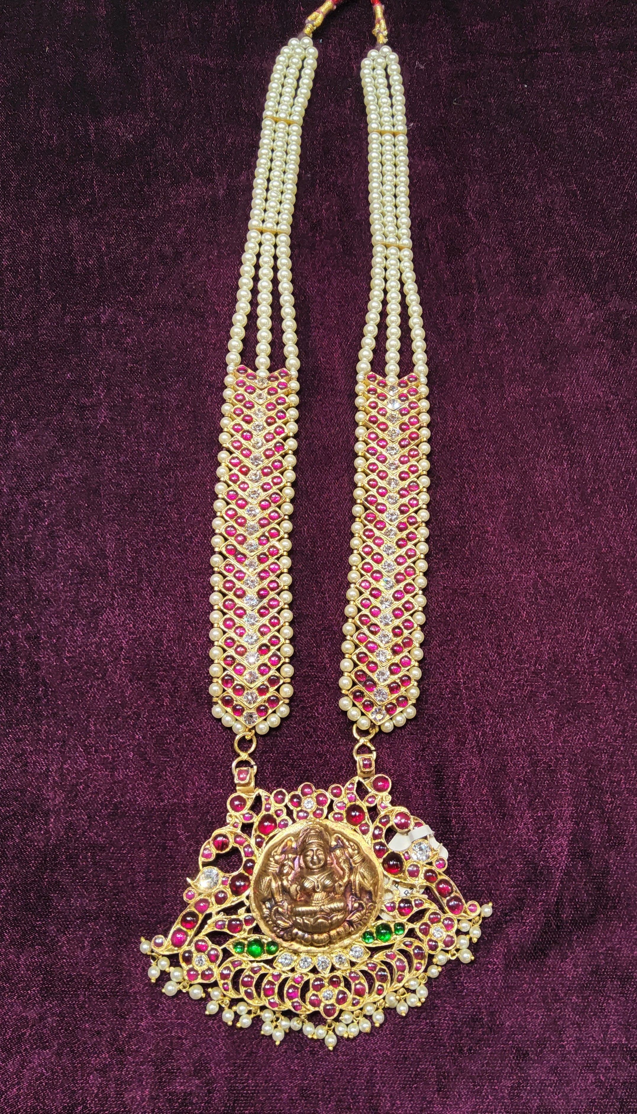 Lakshmi Haram Close-up: Temple jewellery pendant with pearl V Haram detail. Bharatanatyam, Kuchipudi.