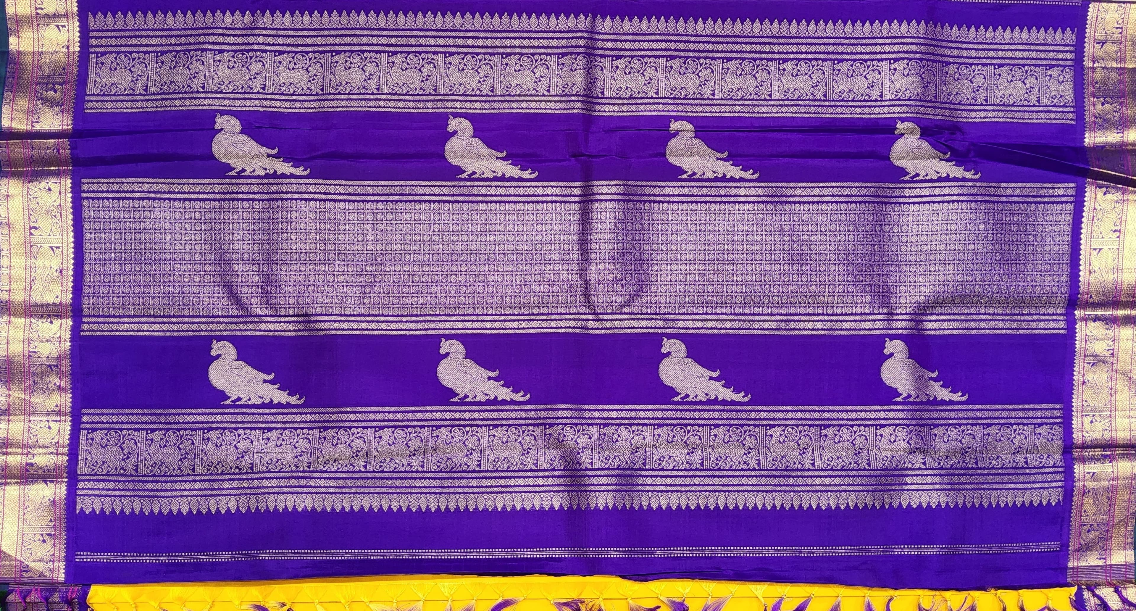 Close-up: Yellow Kanchipuram Saree with Purple Border & 2G Gold Zari work.