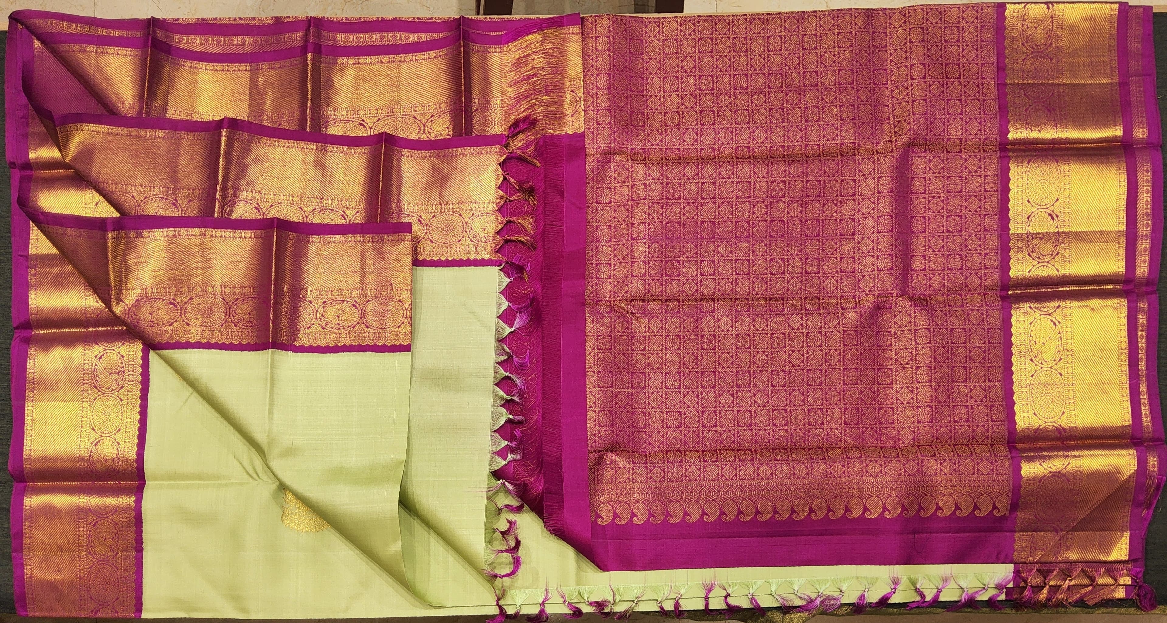 Close-up Light Green and Pink Kanchipuram Silk Saree HSN01. Handwoven silk texture.