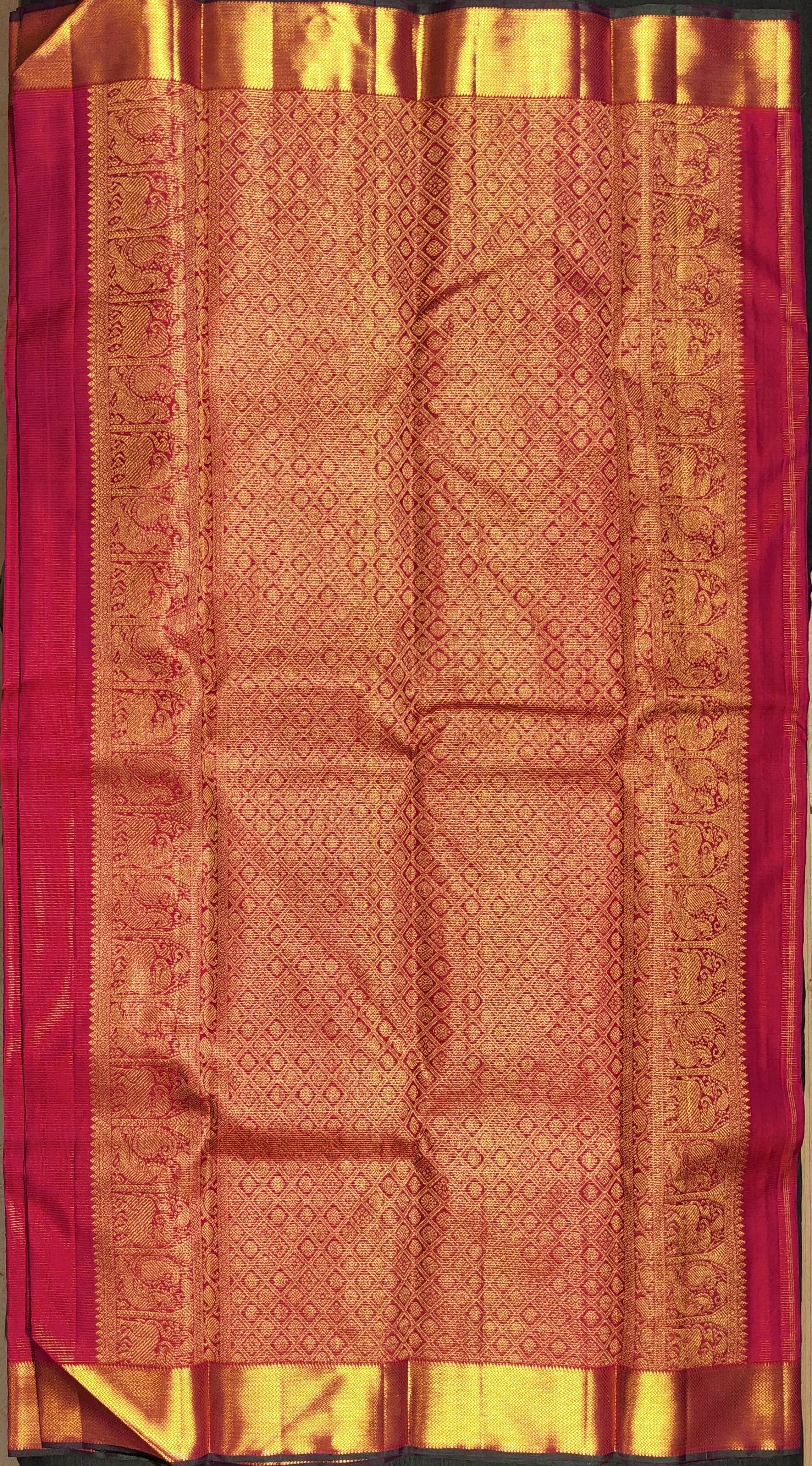 Close-up of Majentha Kanchipuram silk saree, showcasing intricate weave. Perfect dance practice saree.