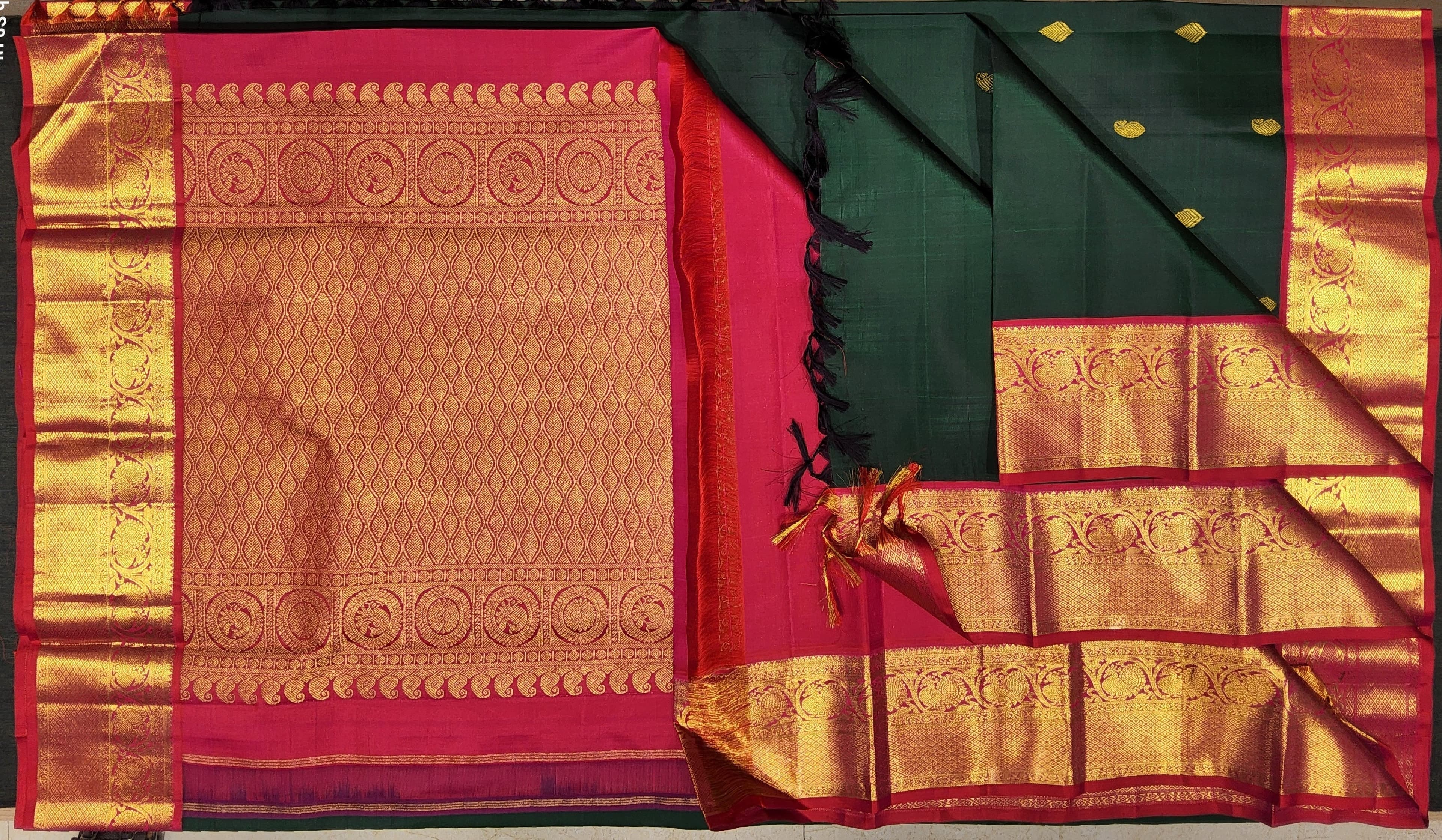 Green Kanchipuram silk saree with red, perfect for weddings
