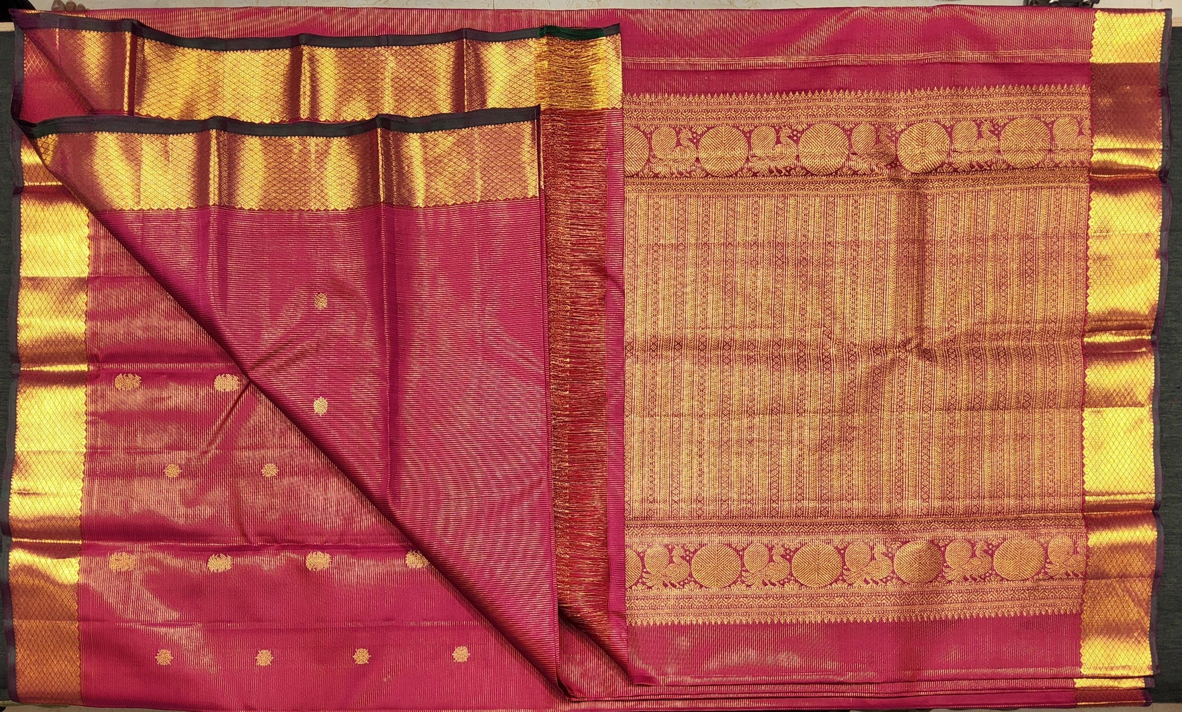 Kanchipuram silk saree: Pink and gold zari design.