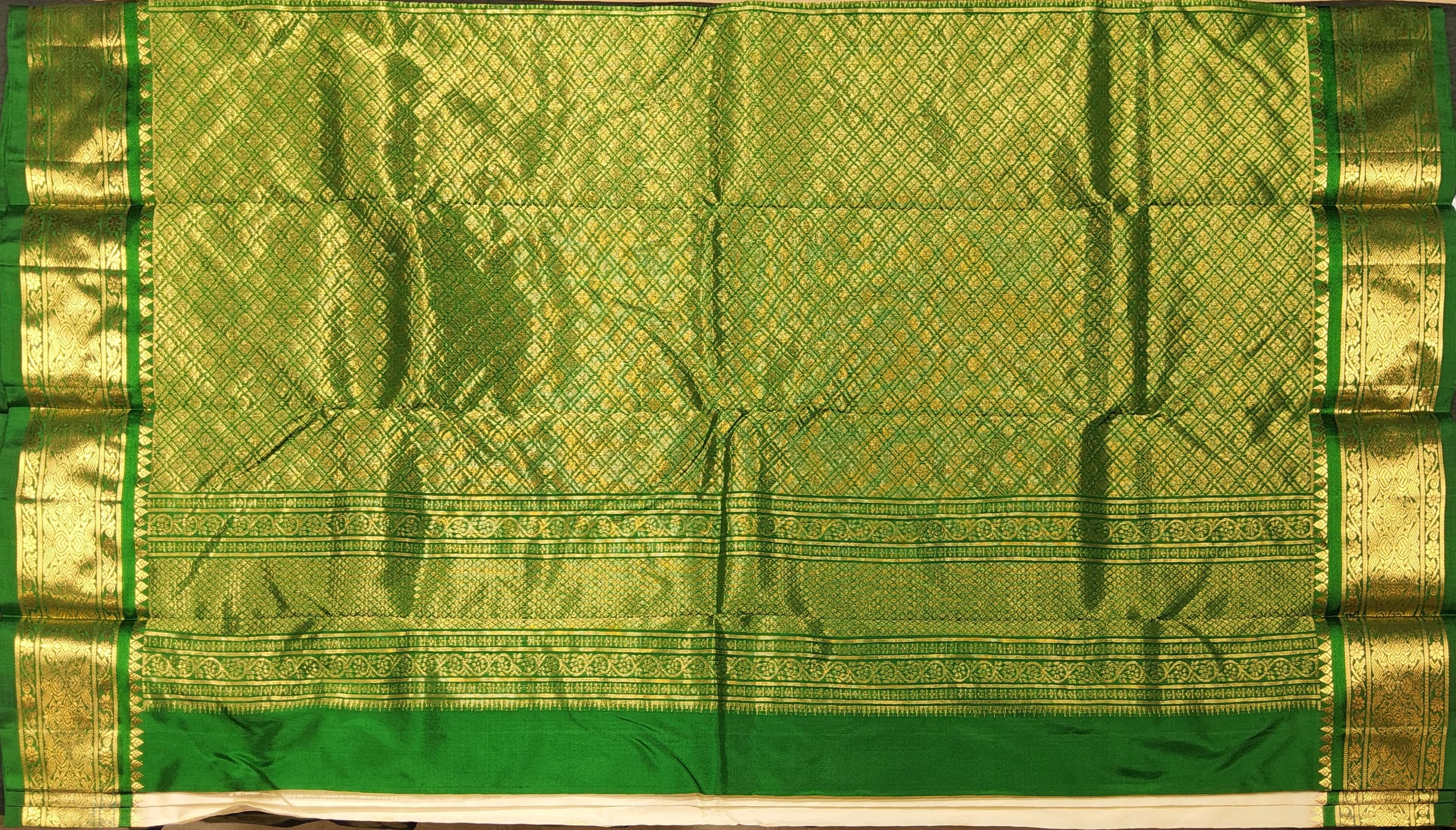 Close up: Dharmavaram Silk Saree's rich zari border, ideal for Bharatanatyam costume and Arangetram.