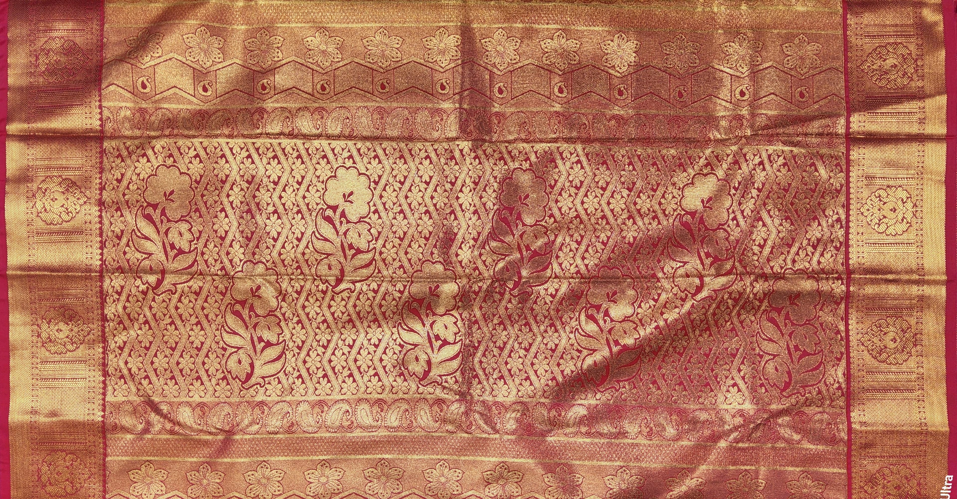 Close-up of Rani Pink border with gold zari work on off-white Margam saree. Ideal dance practice saree.