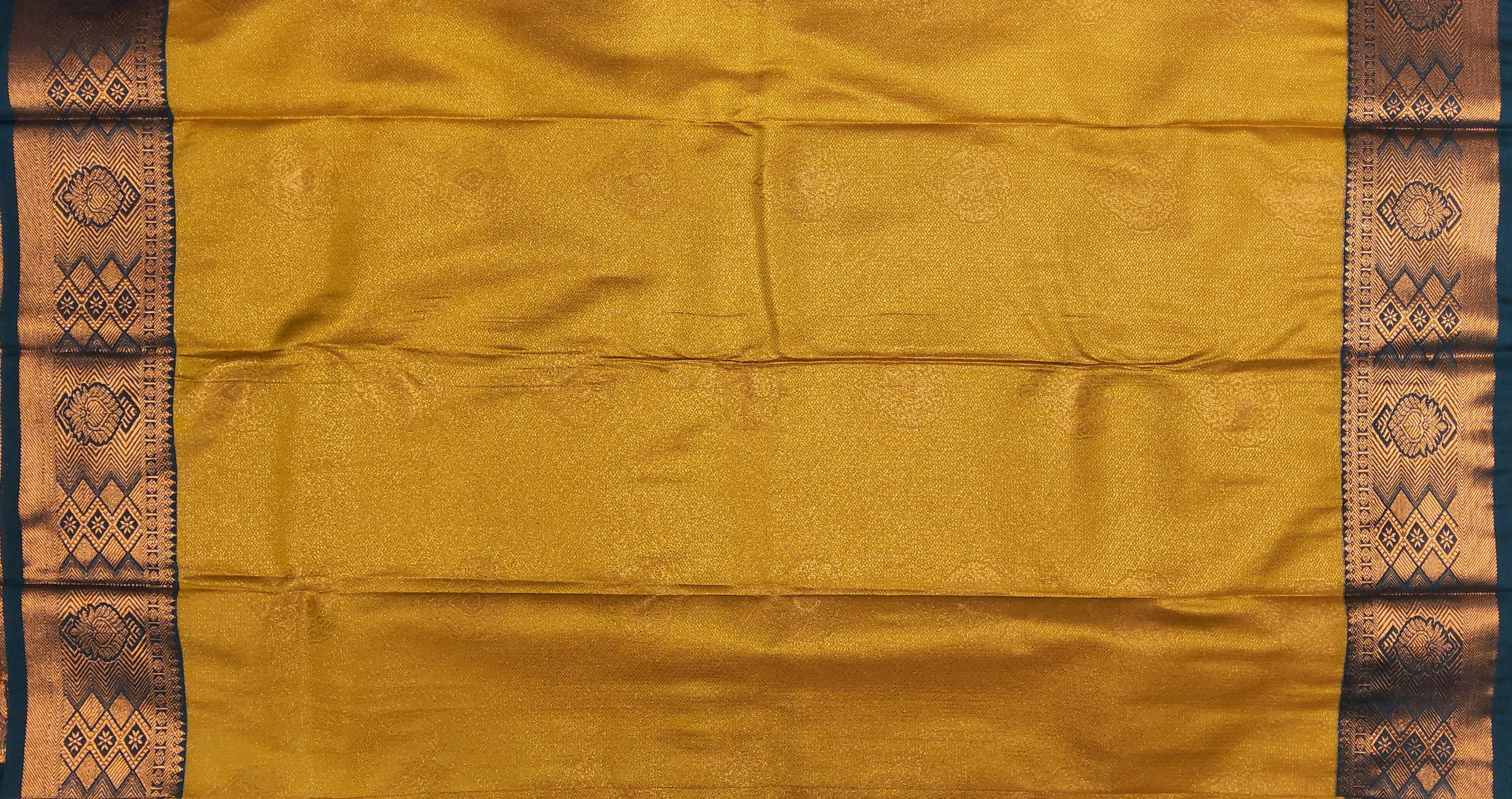 Close-up of copper zari work on Dharmavaram saree, Bharatanatyam practice saree detail
