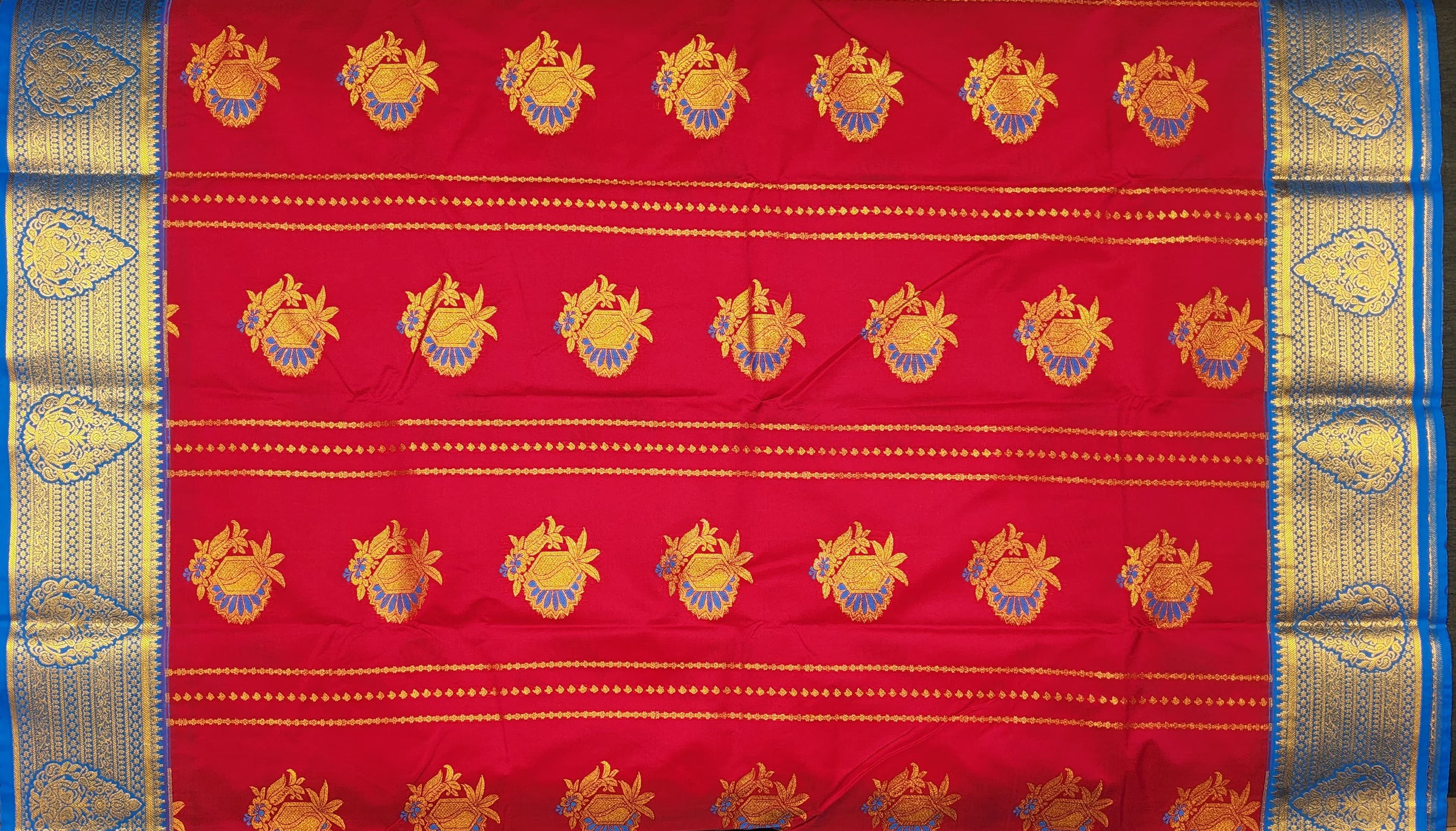 Close-up of Lakshmi silver base gold leaf haram temple jewelry detailing.