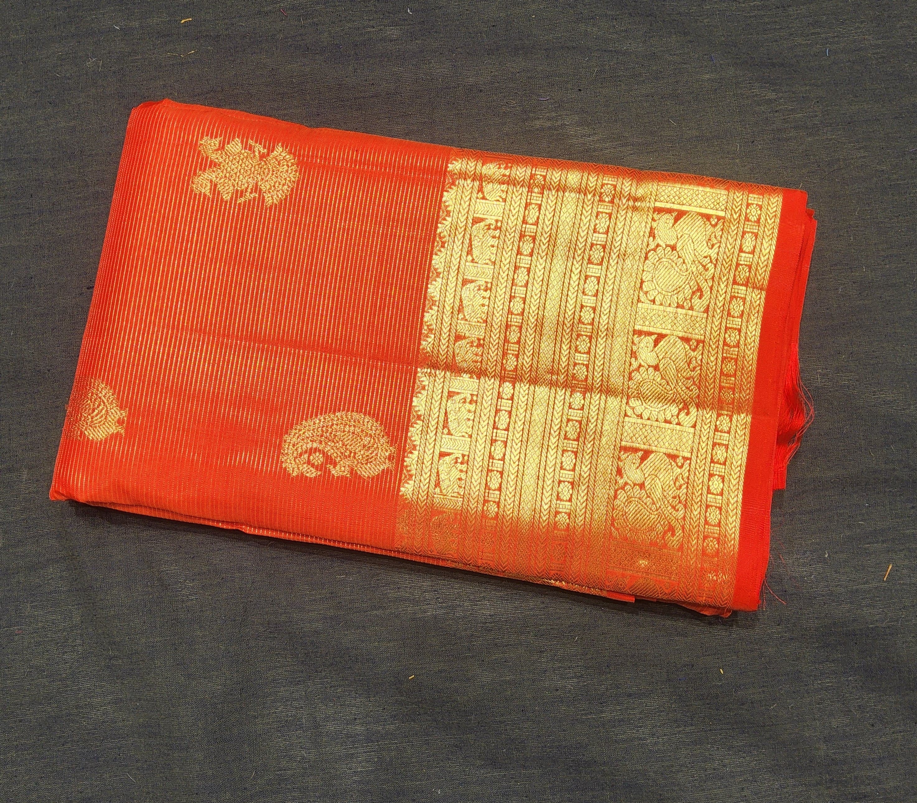 Orange Kanchipuram authentic silk saree for Arangetram, gold zari border.