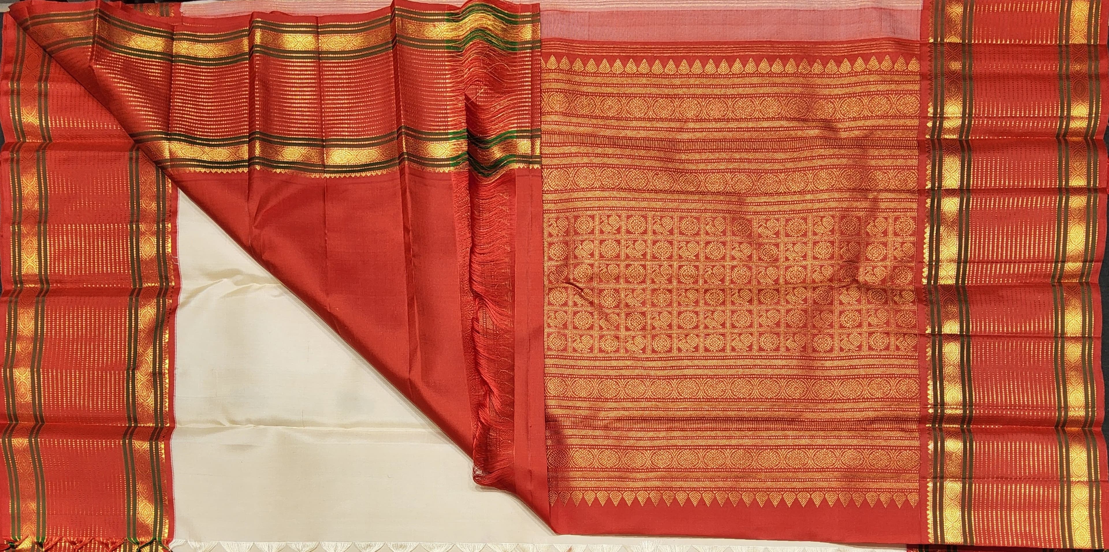Full view of Off white Kanchipuram authentic silk saree, classic Arangetram choice.