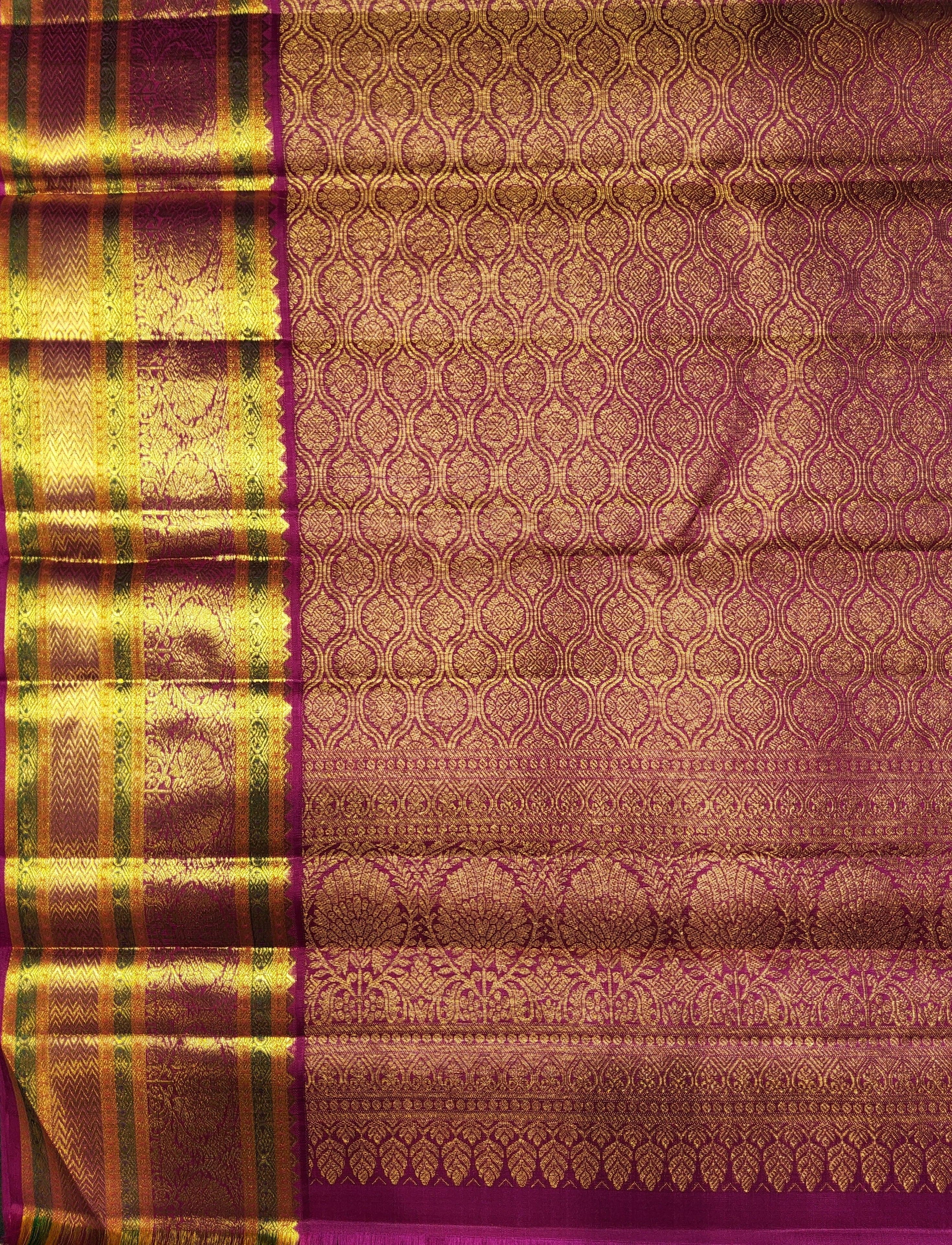 Model wearing a Green Kanchipuram authentic silk saree. Arangetram costume inspiration, pink blouse.