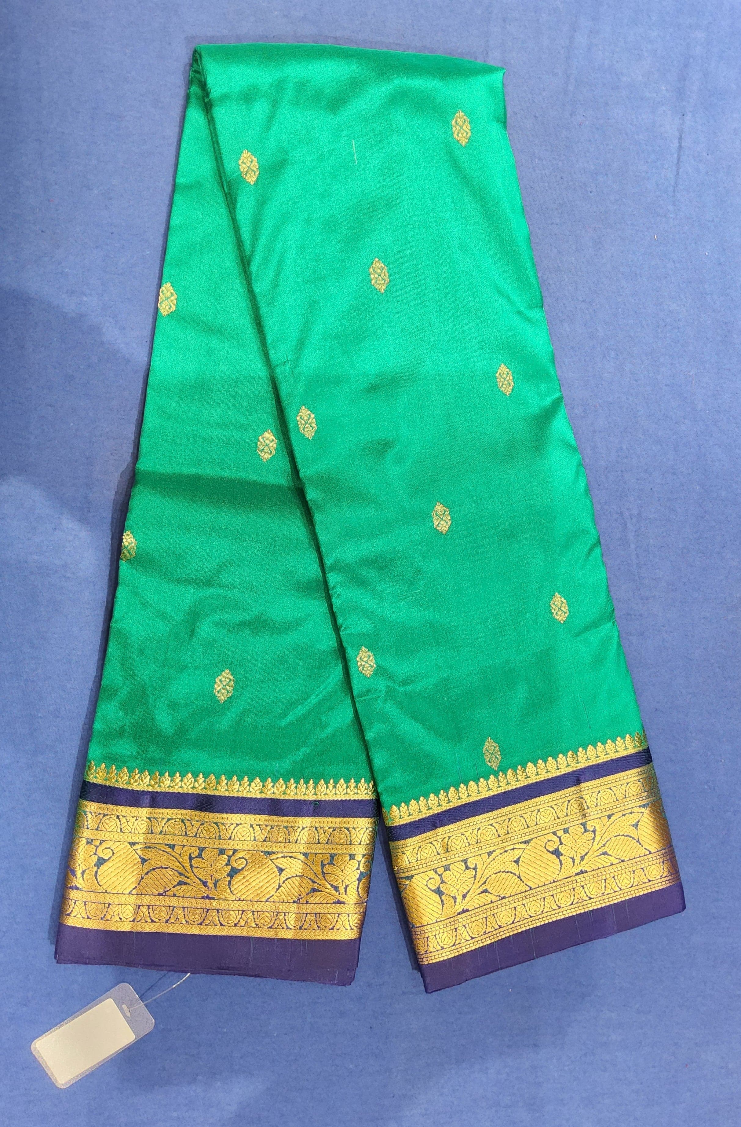 Dharmavaram sarees: Close-up of gold zari peacock on blue border. Authentic silk bharatanatyam practice saree.