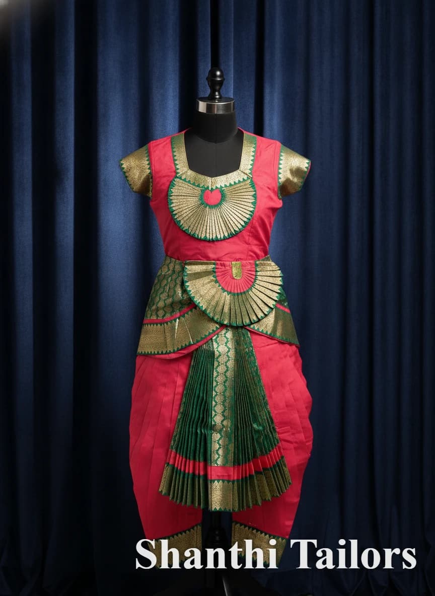 SSD Readymade Bharathanatyam costume, red & green with gold accents & pleated fans, on a mannequin.