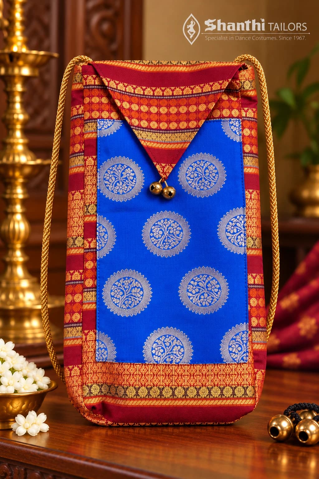 Vibrant blue & maroon Salangai & Manai Bag (கலைப்பேழை) with gold brocade, brass bells. Carry your dance tradition.