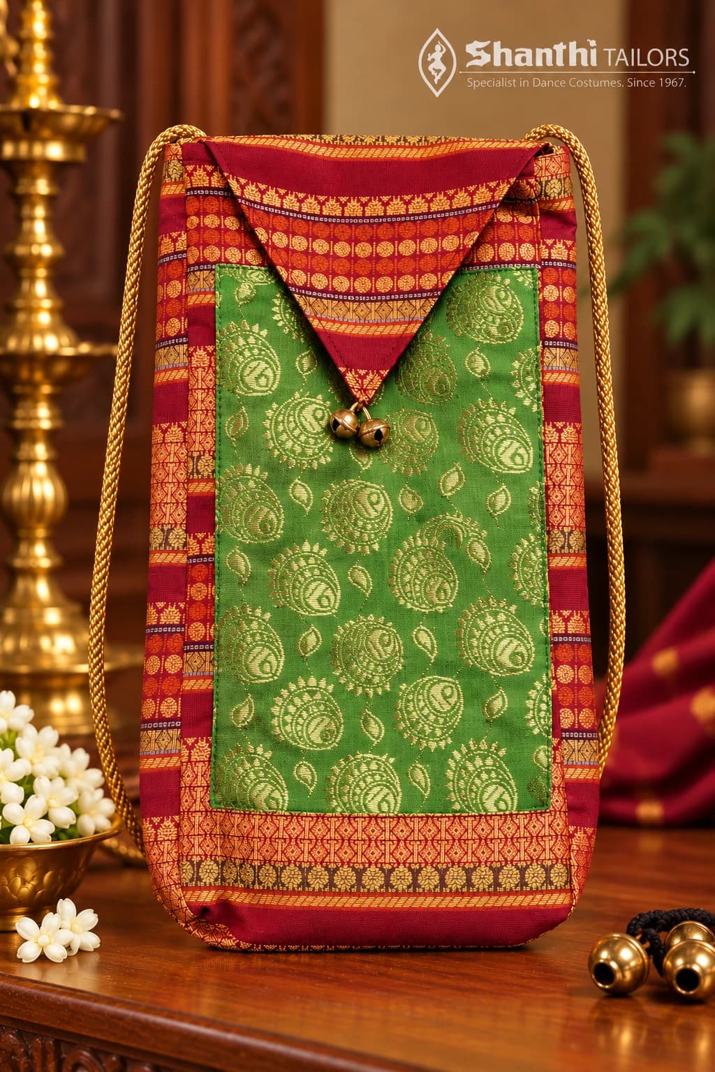 Green & red Salangai & Manai Bag (கலைப்பேழை) with gold paisley design and bells, for dance tradition.