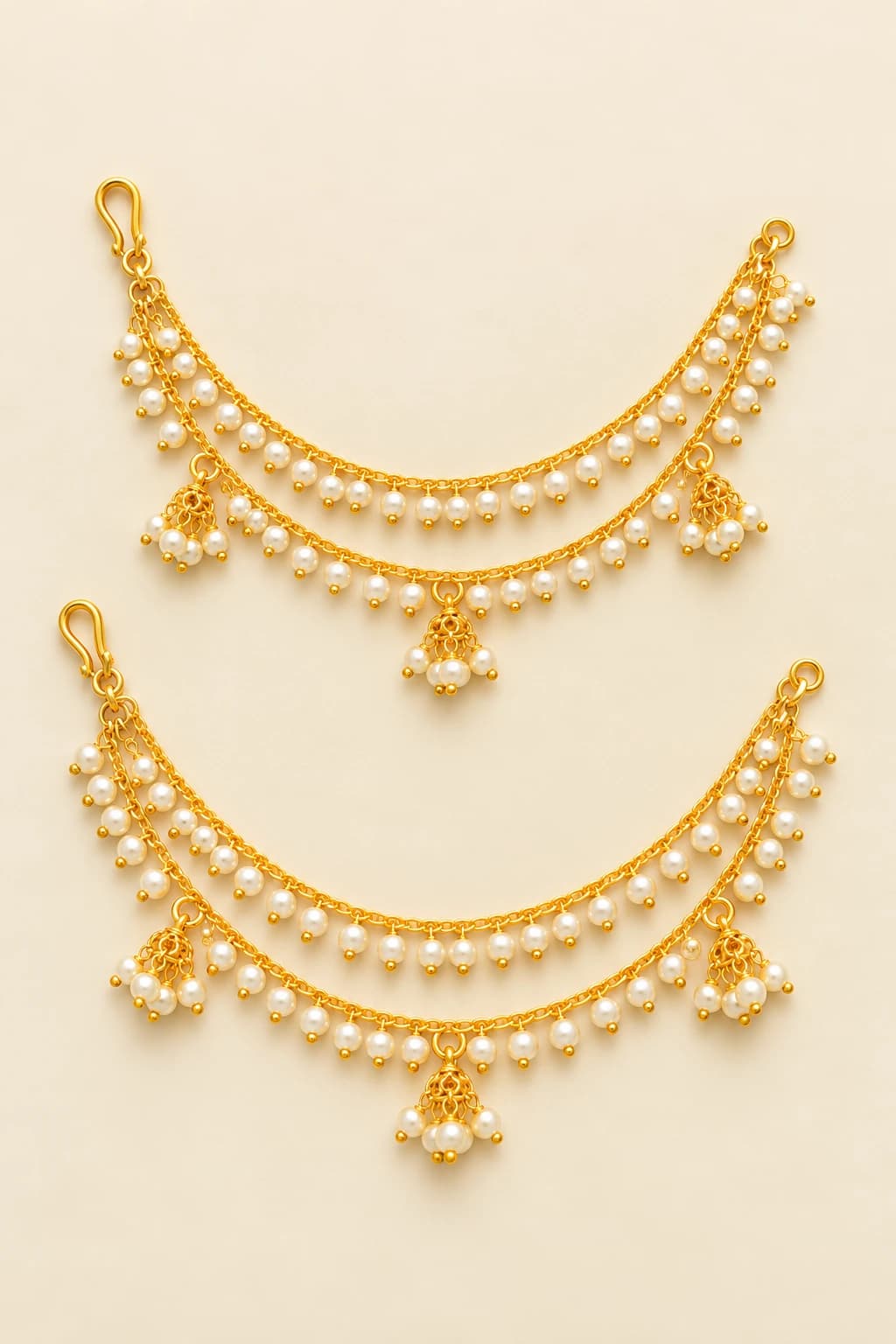 Antique Mattal fashion jewellery: Two gold-toned ear chains with pearl drops.
