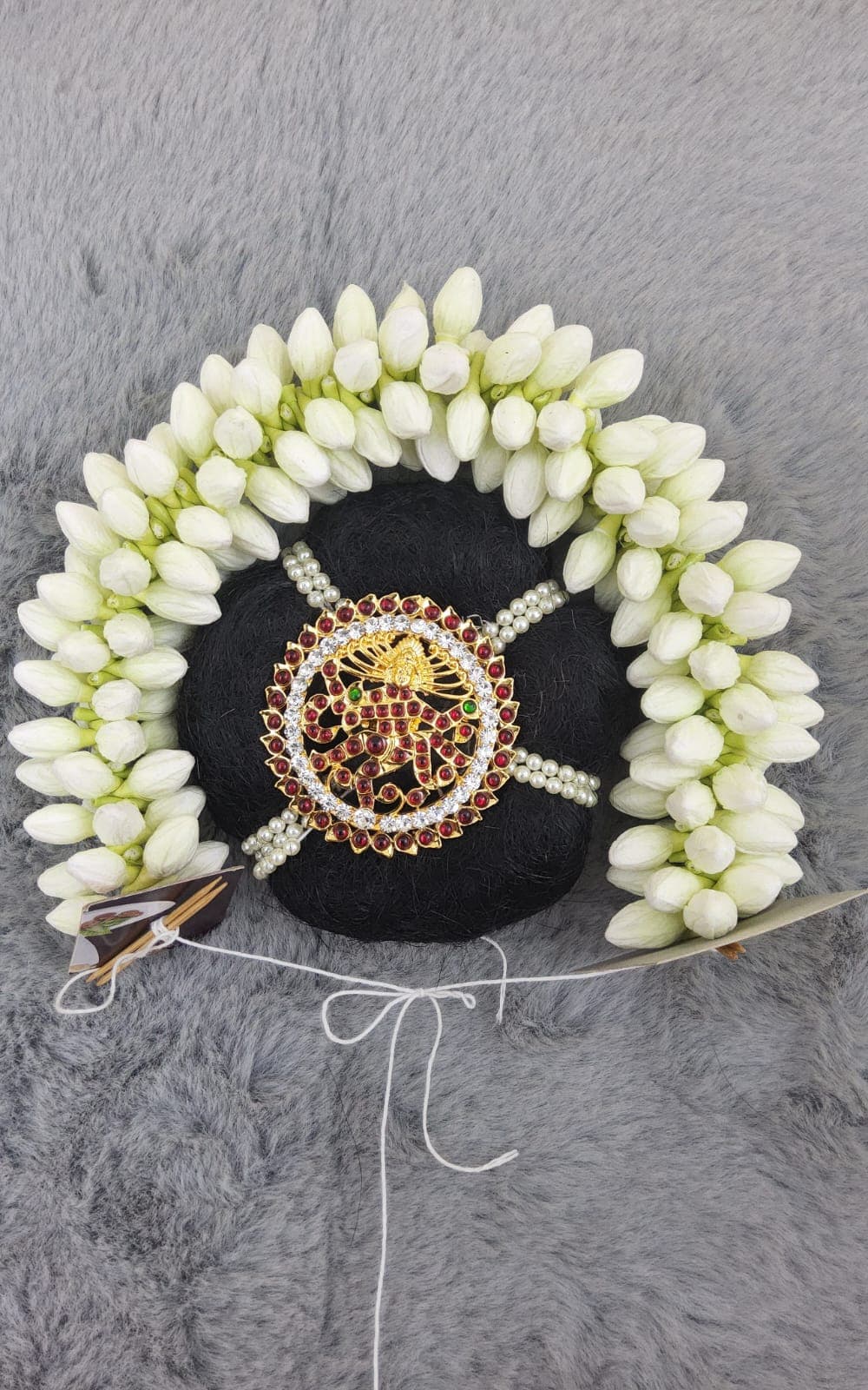 Close-up of Realistic Jasmine Flower Hair Accessory for Bharatnatyam, showing detail.