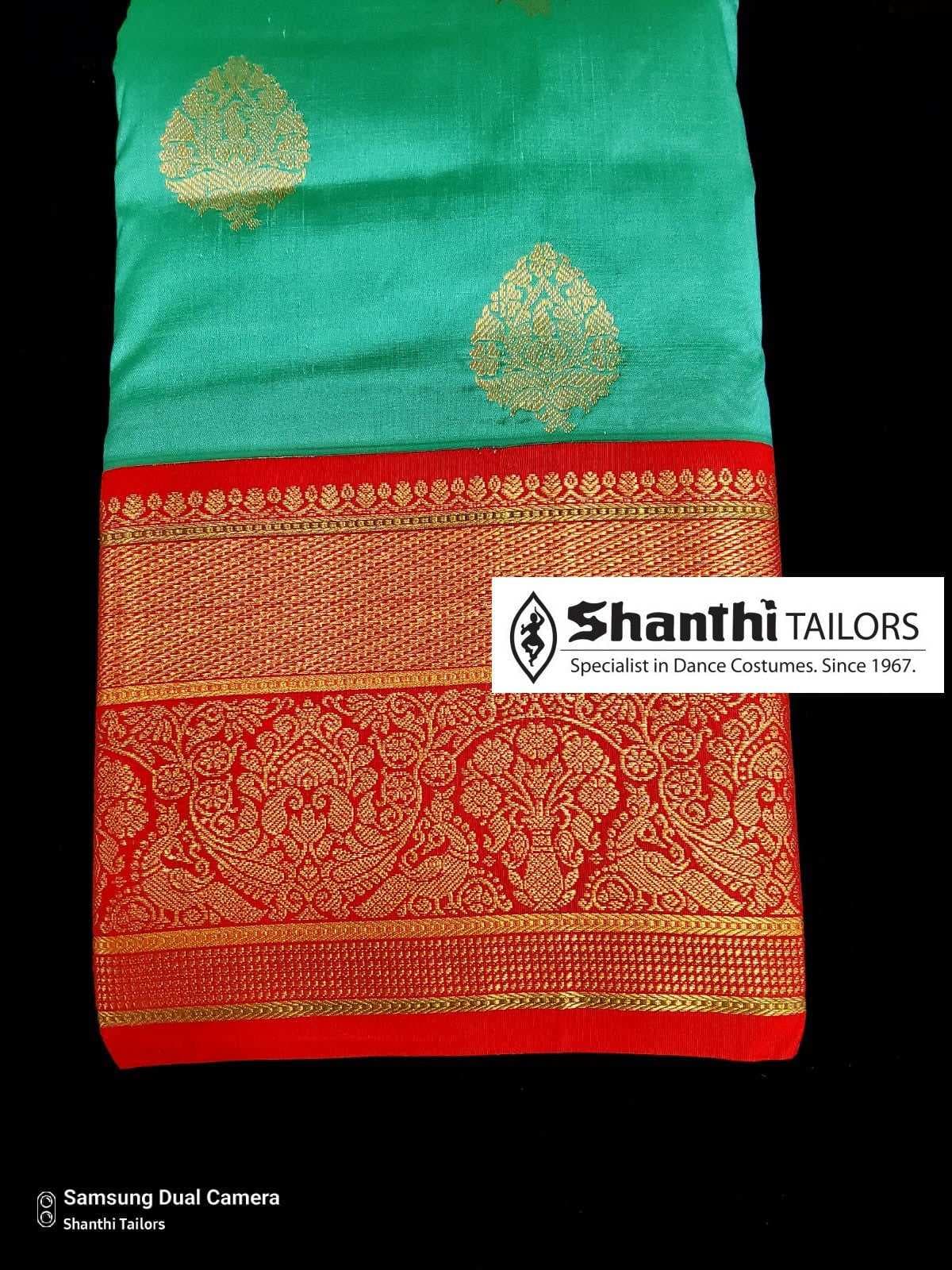 Full view of off-white Artificial Kanchipuram silk saree. Good for Bharatanatyam dress.