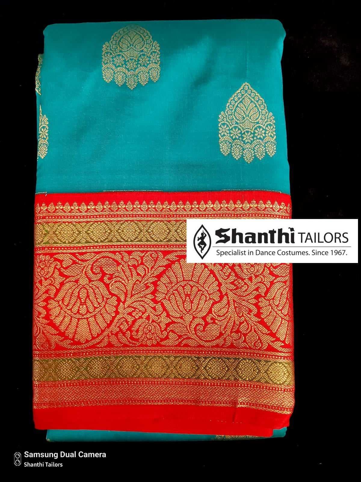 Artificial Kanchipuram silk saree pallu detail. Practice saree with gold zari motifs.