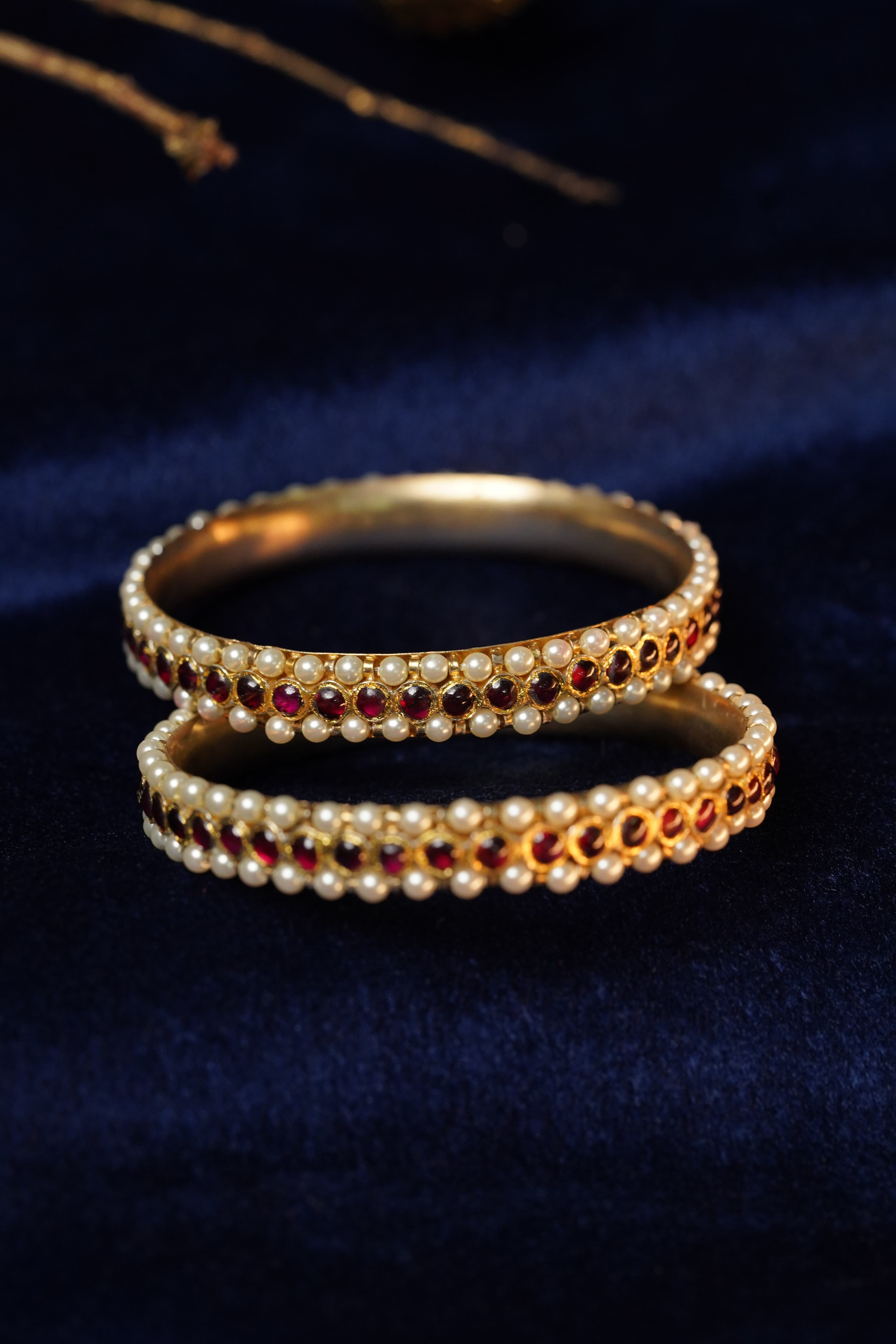 Pearl Maroon Stone Bangle: Stylish gold bangle with pearls and maroon stones, dance function jewelry