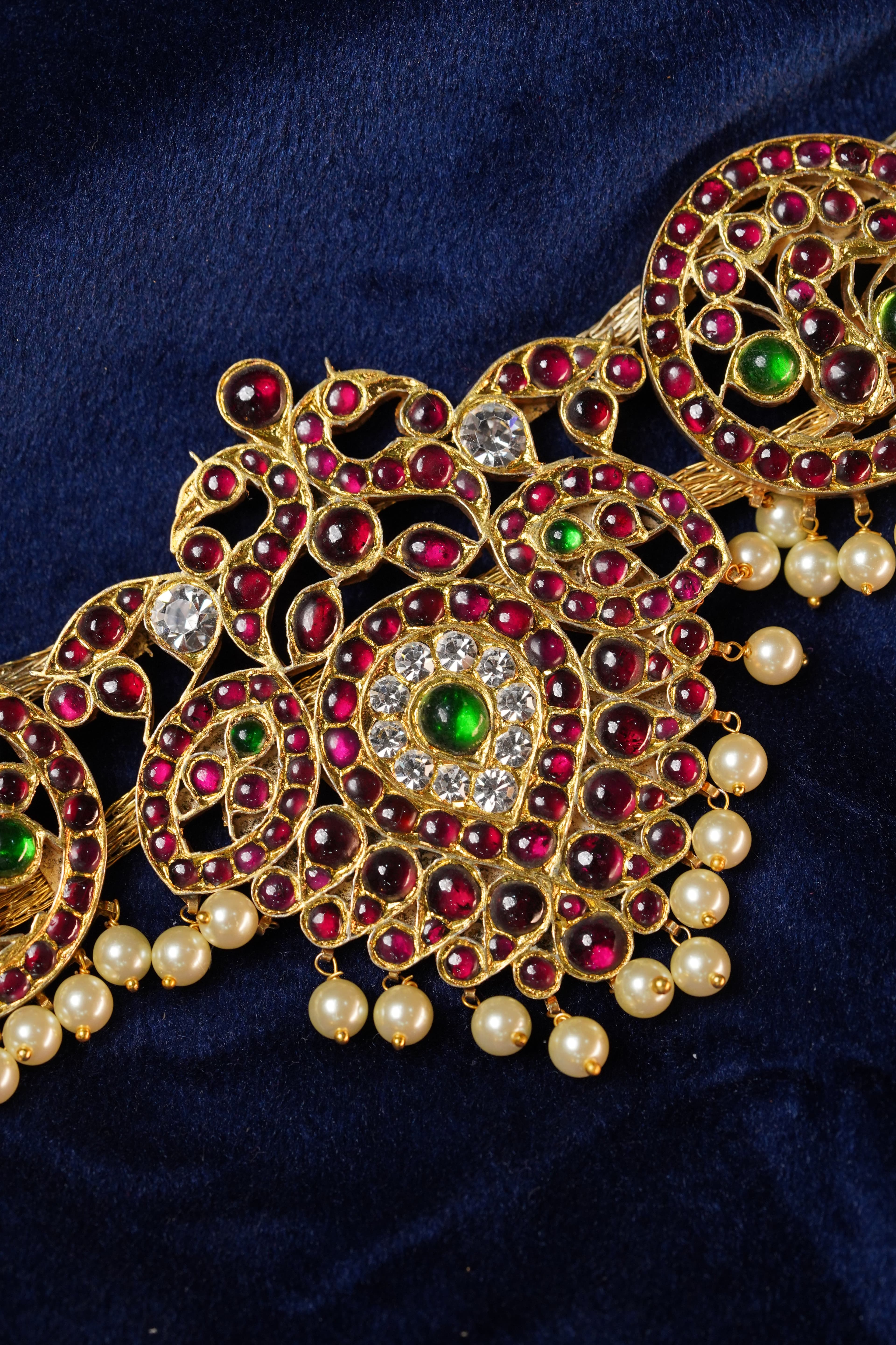 Close-up: Exquisite details of the Peacock Belt, a gold plated temple jewellery hip belt for dancers.