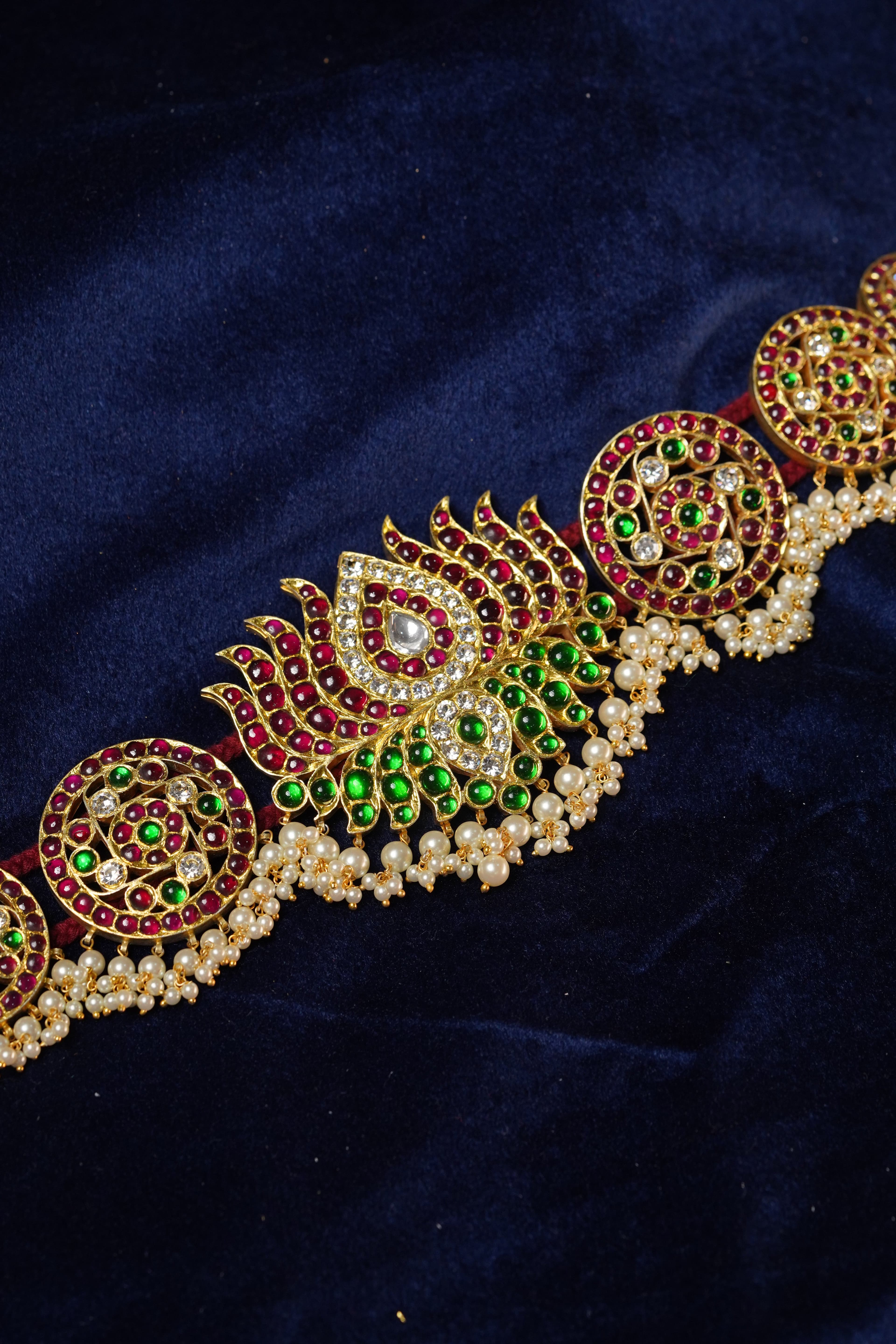 Lotus Hip Belt: Detailed view of lotus motif on gold-plated silver temple dance jewellery.