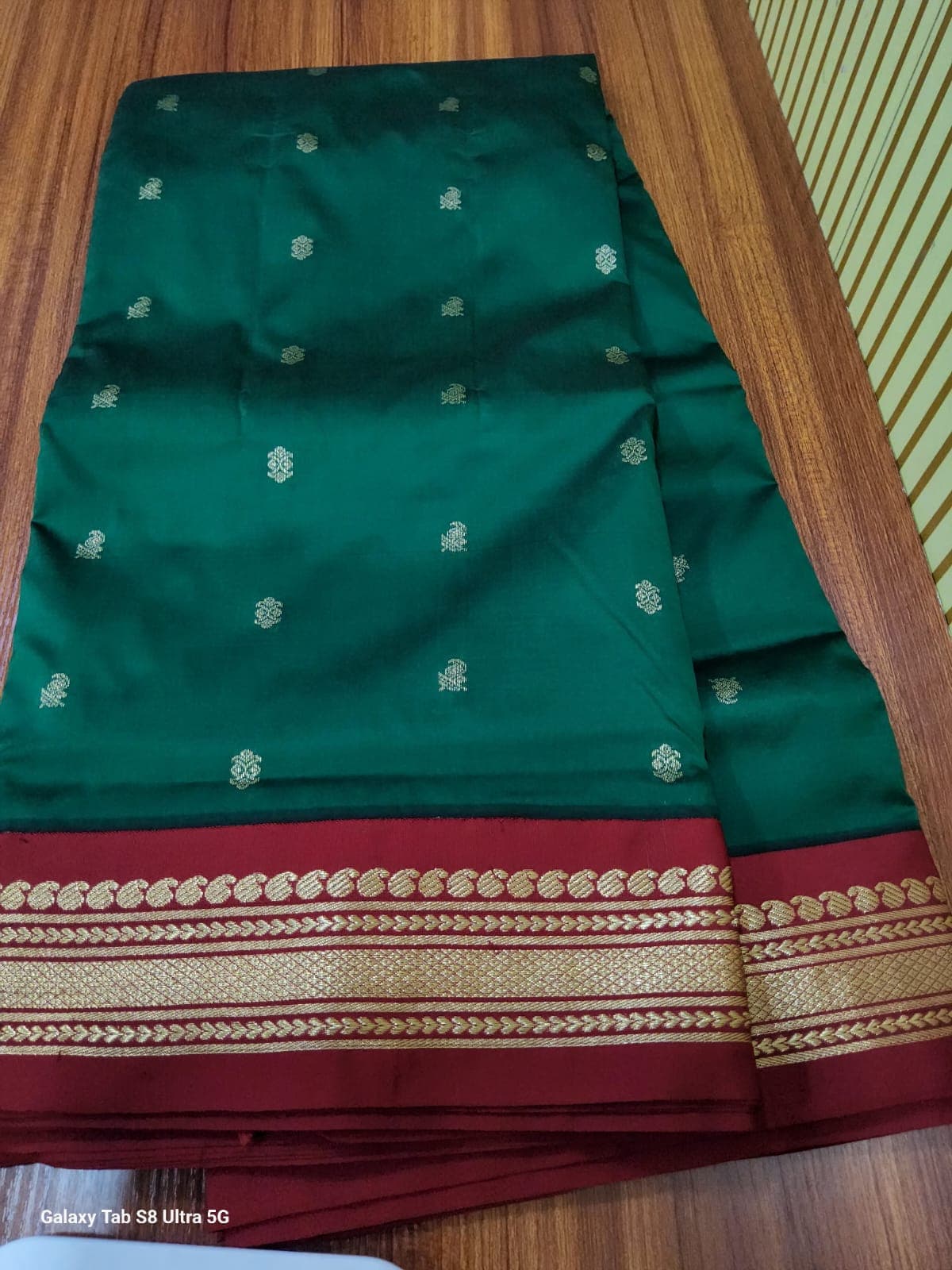 Dark green Madi Saree with red border. Traditional 9-yard saree.