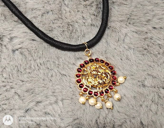 Close-up of lightweight black thread necklace, imitation jewelry, ideal for daily wear
