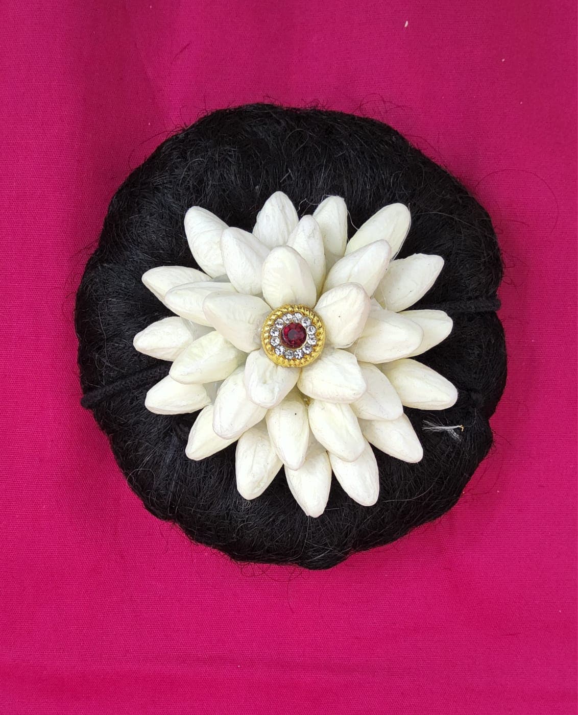 Maroon Flower Rockodi. Detailed view of traditional dance hair flower. Rockodi flower.