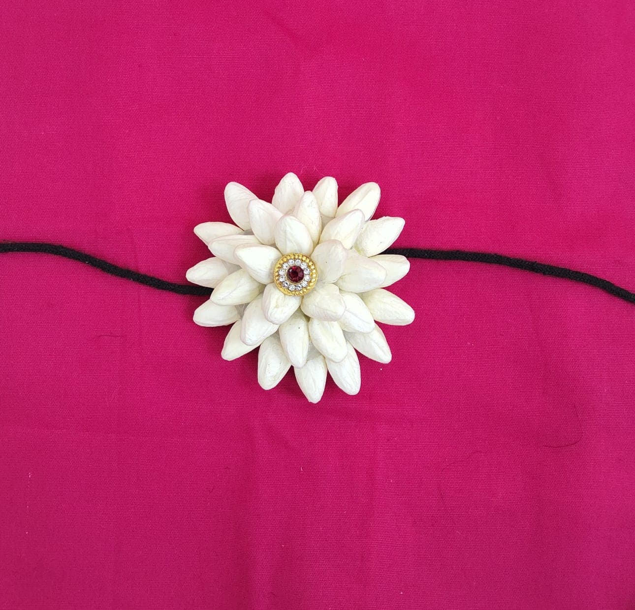 Maroon Flower Rockodi: Single flower hair decoration for Bharatanatyam dance hairstyles.