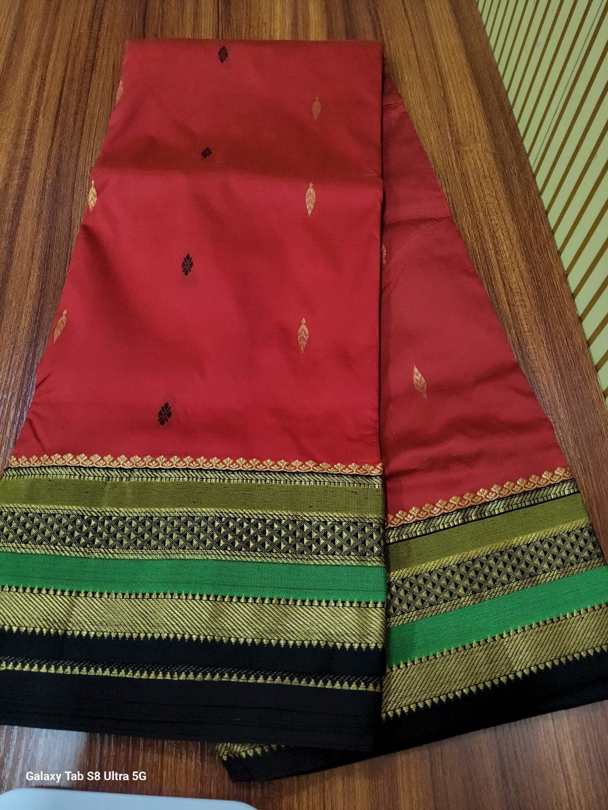 Red Madi Saree with green border. Semi silk readymade saree.