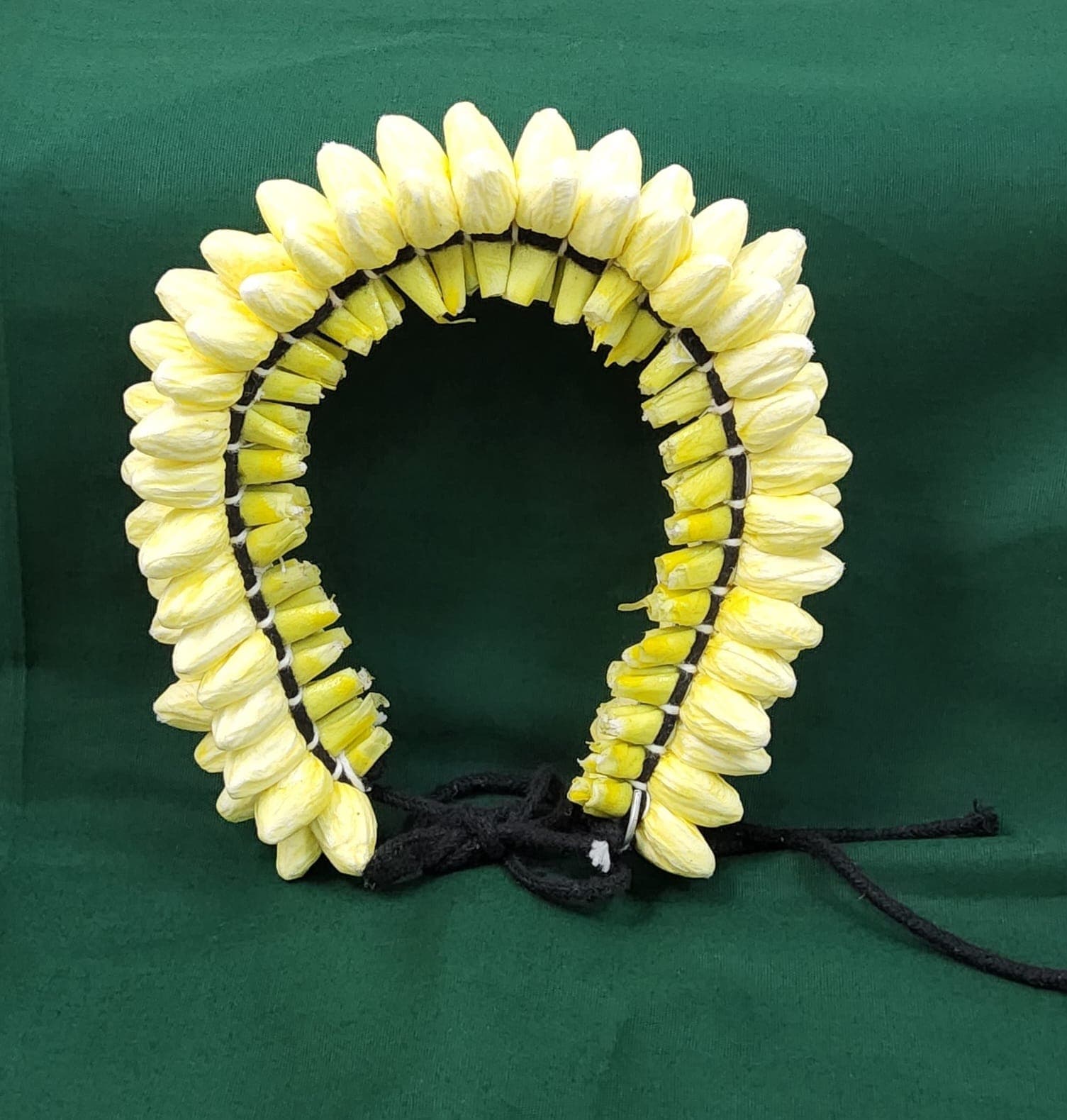 Shanthi Tailors Pvt Ltd: Yellow paper mould jasmine flower hair decoration, Bharatanatyam adornment.