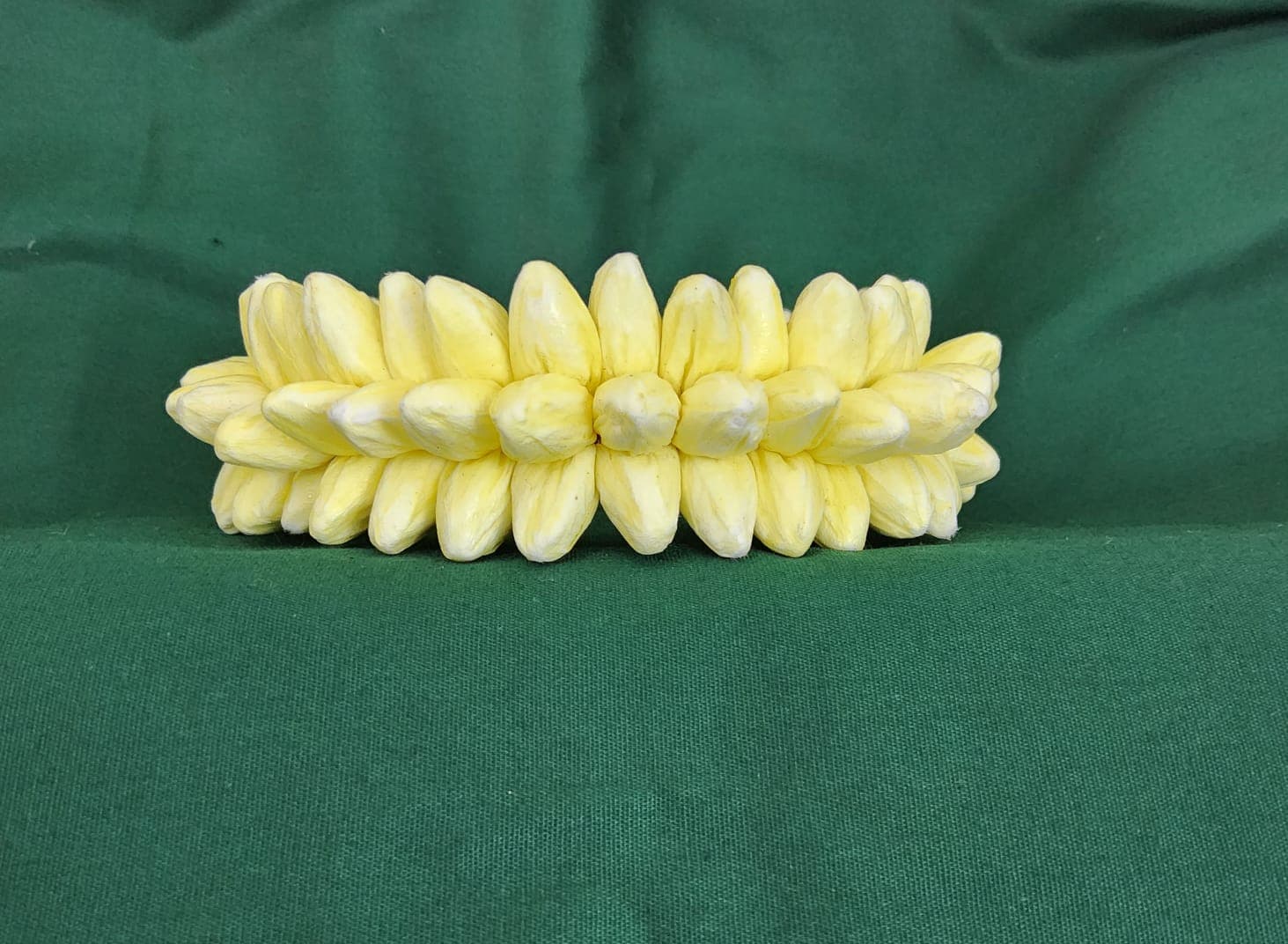 Shanthi Tailors Chennai: Yellow paper jasmine flower, Bharatanatyam hair accessories detail.
