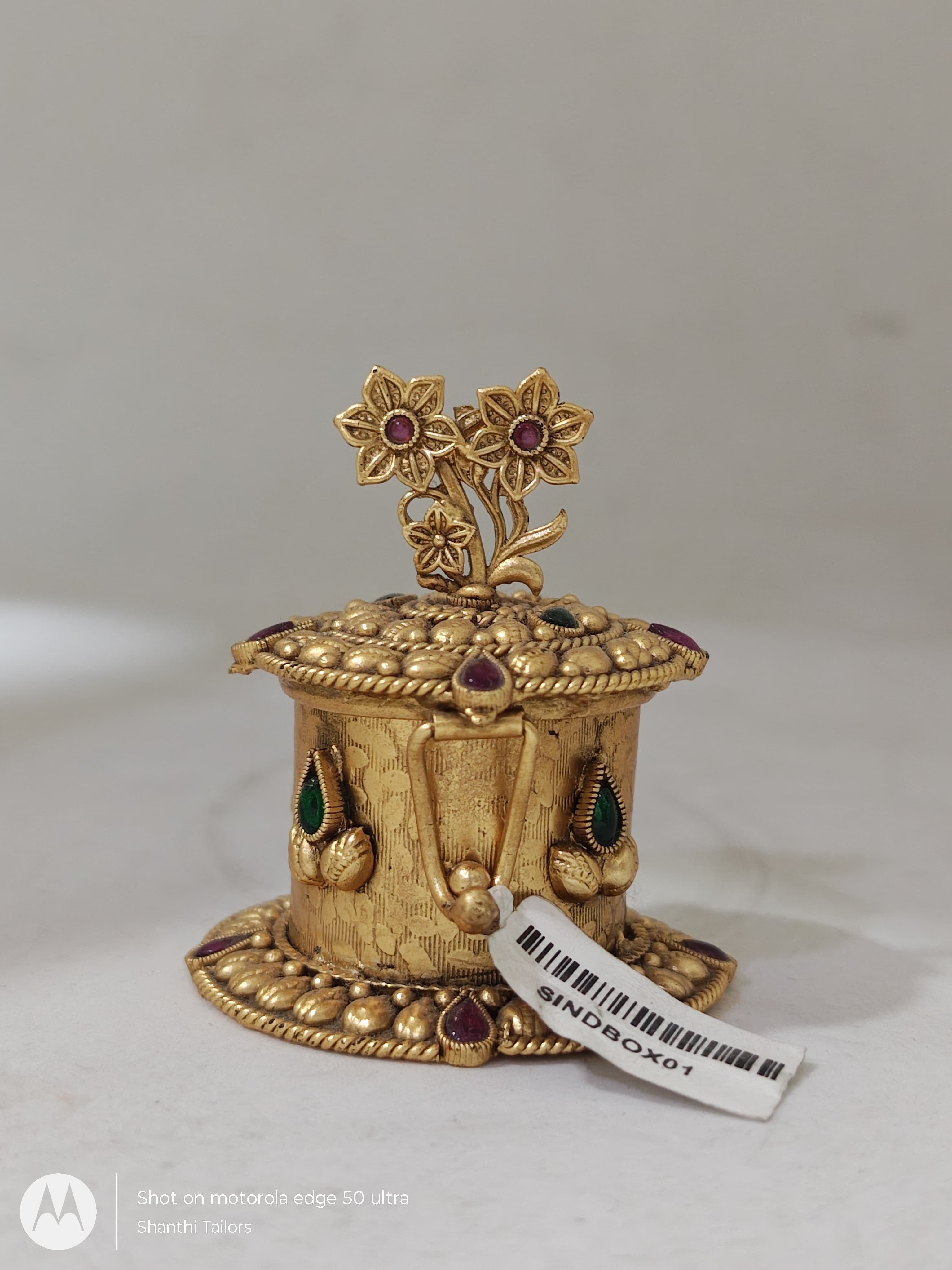 Close up of Sindoor Box, showcasing intricate design details. Sacred pooja item.