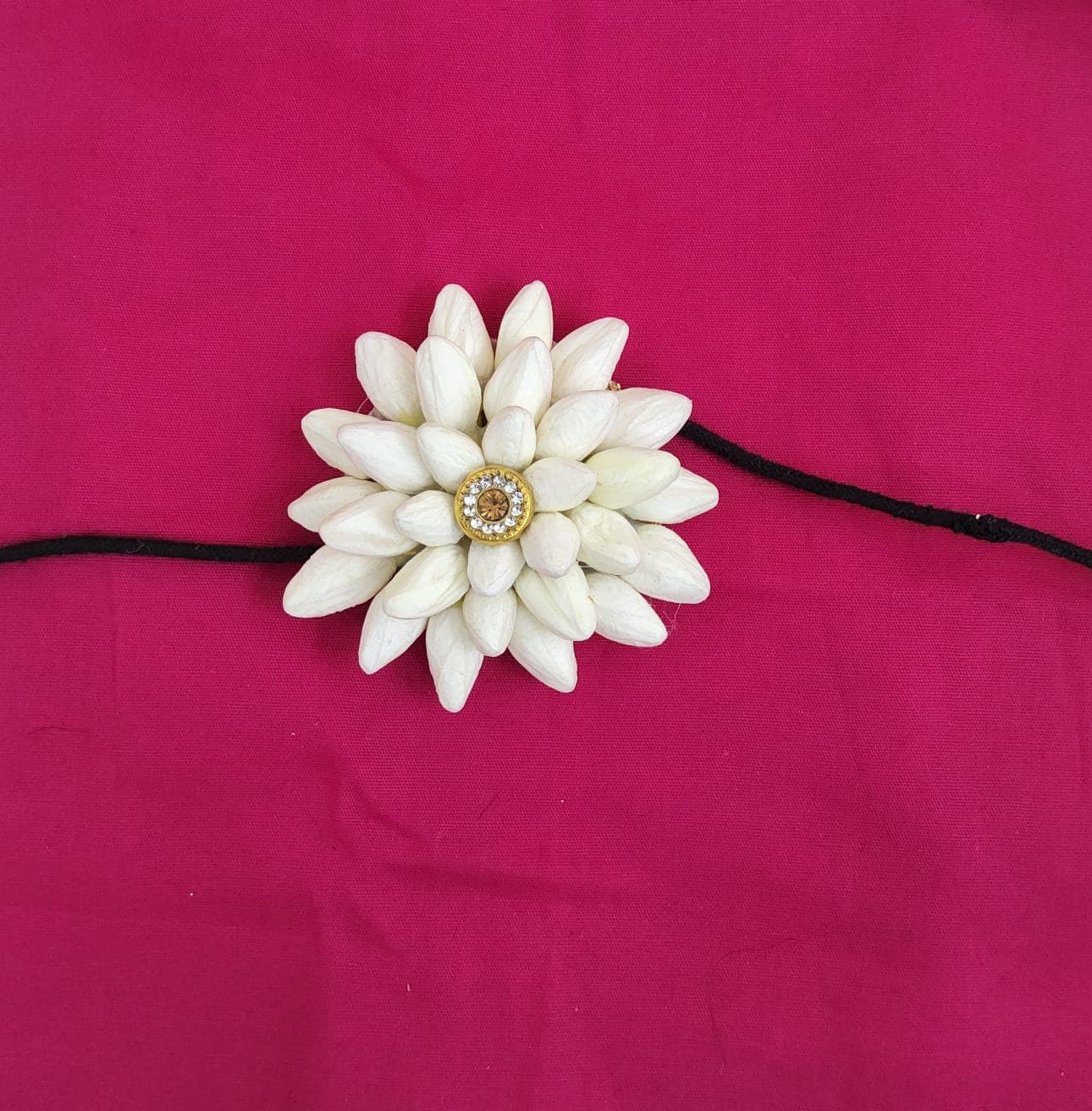 Yellow Flower Rockodi. Close-up of single flower hair piece for traditional dance styling.