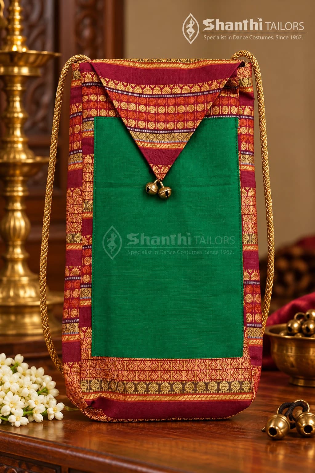 Green and red Salangai & Manai Bag (கலைப்பேழை) with traditional patterns & brass bells. Carry your dance tradition with grace.