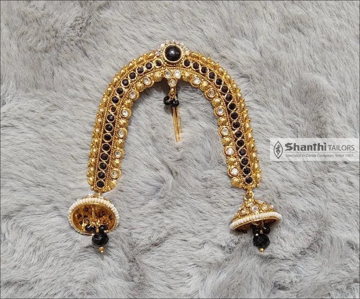 Close-up: Antique Arch Jada Billai hair ornament with black stones, copper alloy dance ornaments